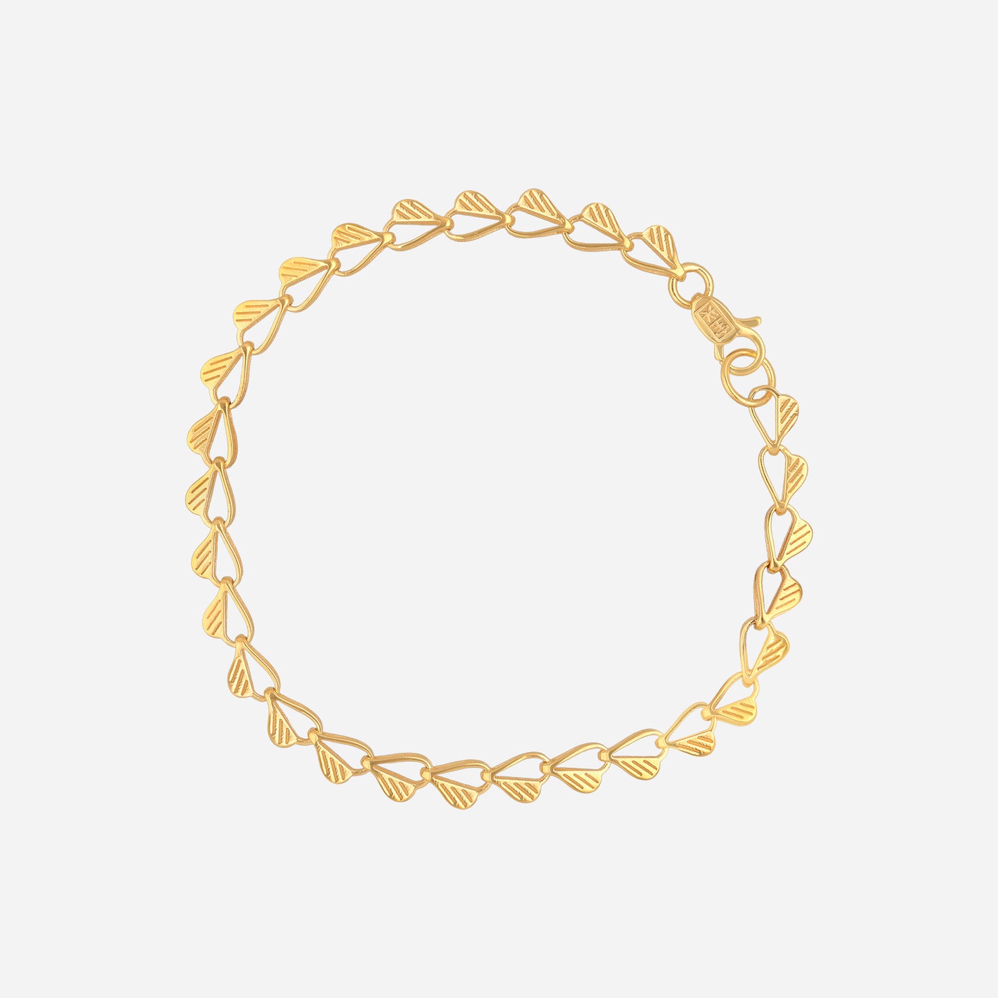 hearty link bracelet in 22k yellow gold featuring openwork hearts with etched grooves, crafted for a charming look.