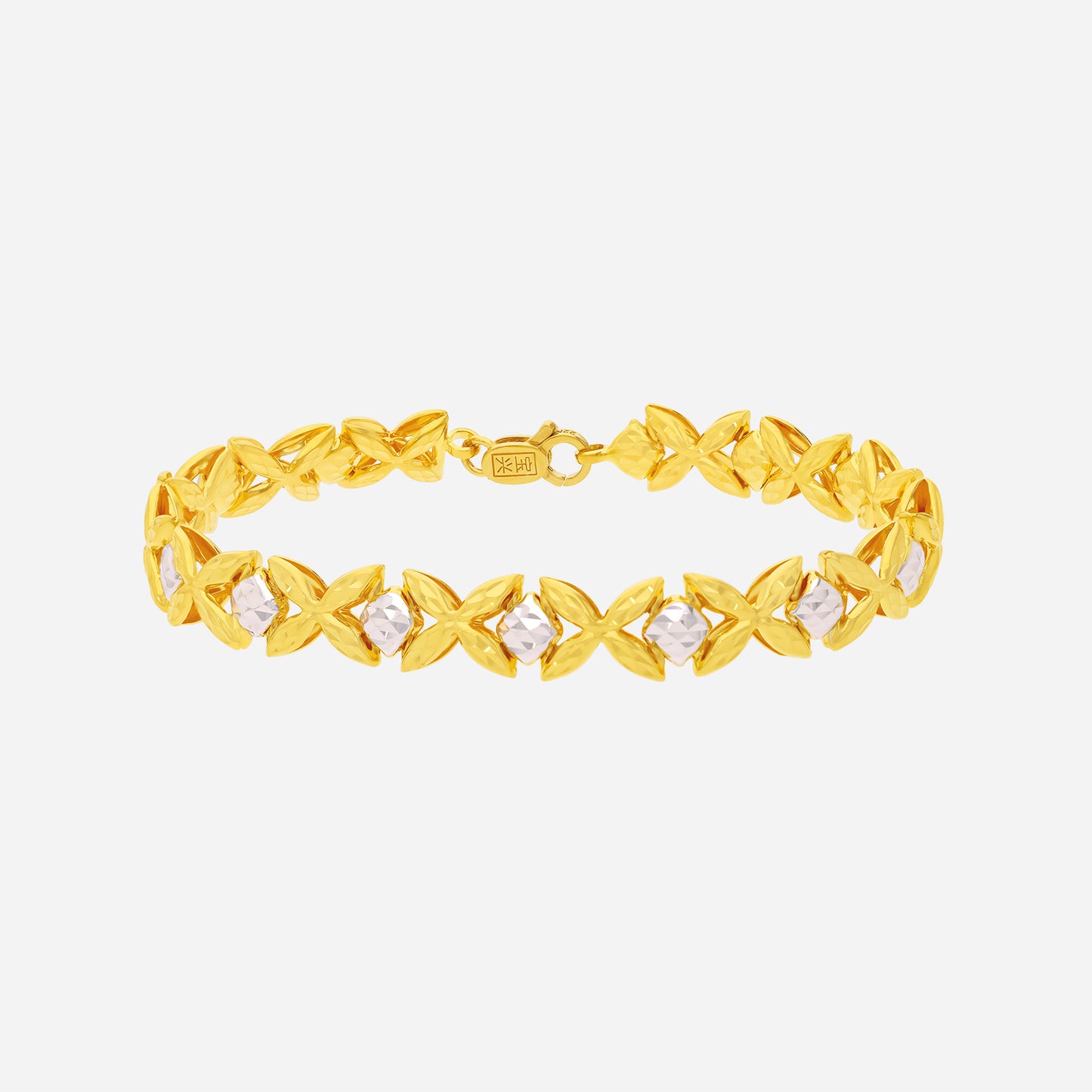 spark petal bracelet in 22k yellow and white gold featuring interlocking petal design with luminous gemstones.