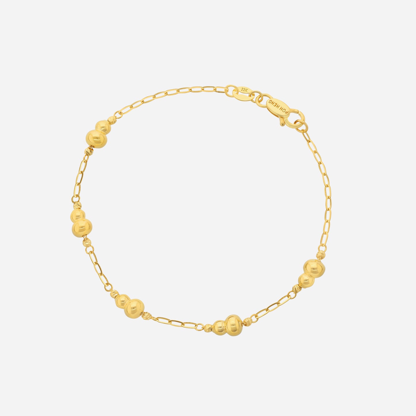 fortune gourd bracelet in 22k yellow gold with smooth, rounded gourd-like beads on a delicate chain.