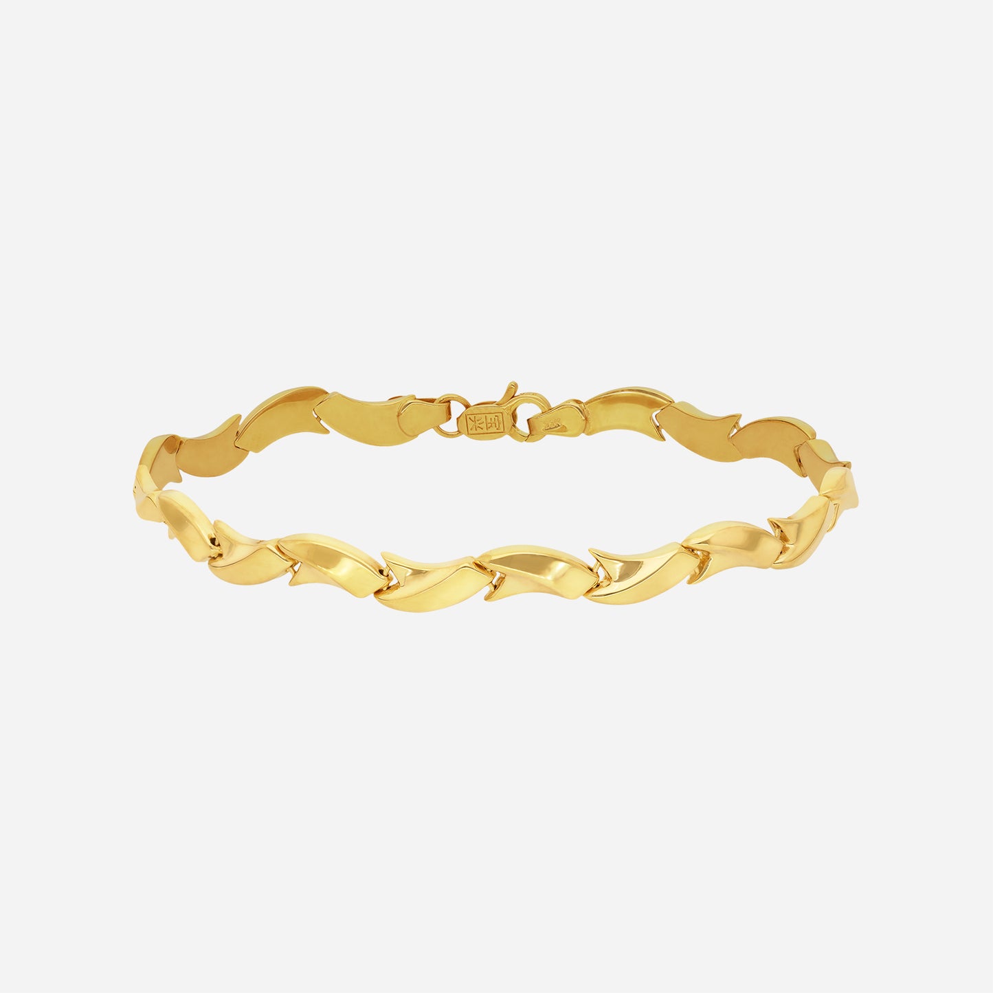 wavy link bracelet in 22k yellow gold with fluid, alternating links catching light beautifully.