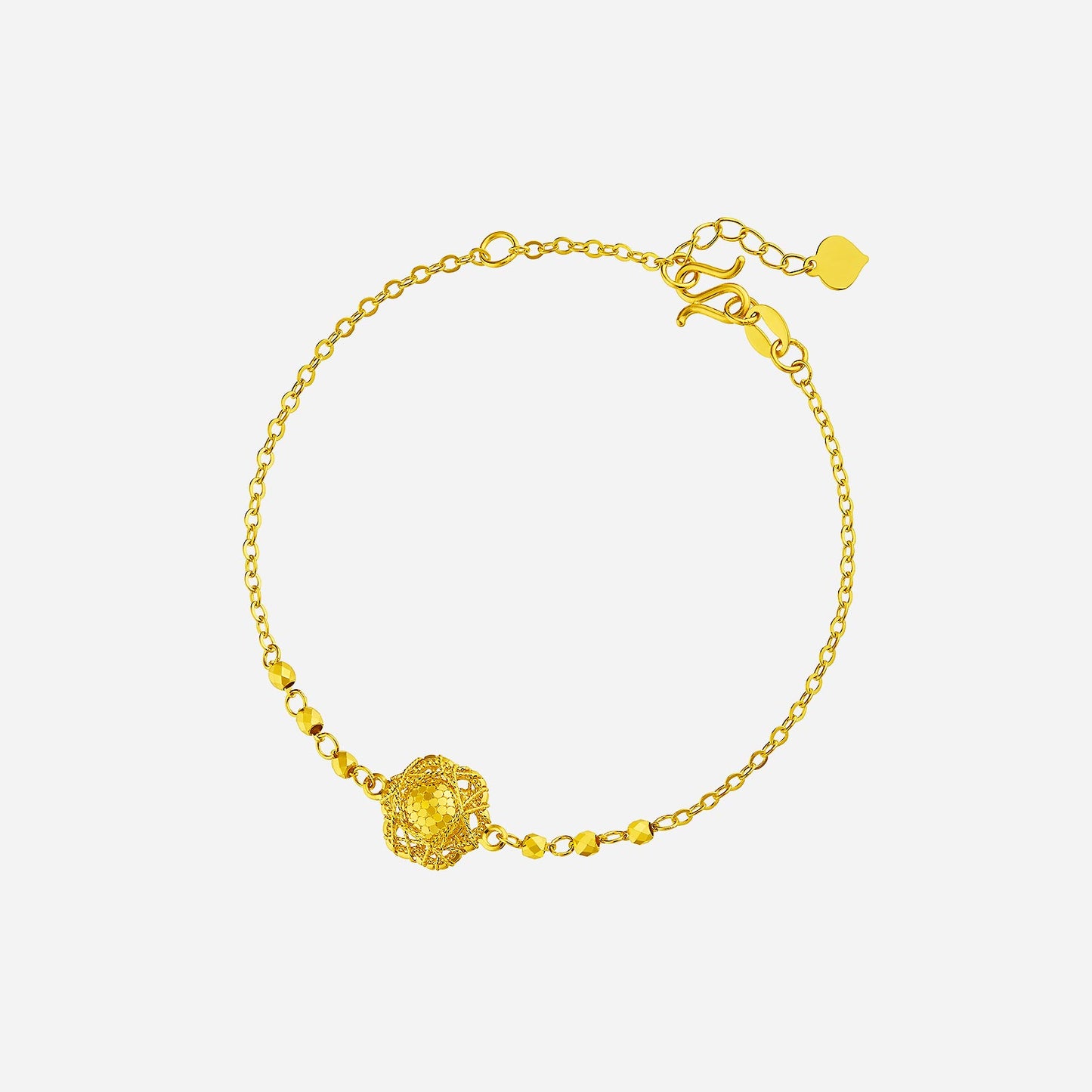 tweed floral bracelet in 24k yellow gold with intricate floral design and elegant chain links. perfect for special occasions.