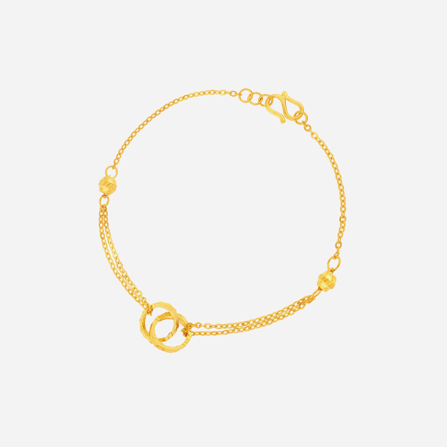 24k yellow gold interlock ring bracelet with fine chain and textured motifs, perfect for understated elegance.