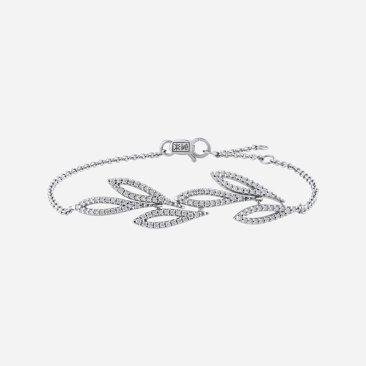 garden of promises diamond bracelet in 18k white gold with elegant foliage motifs encrusted with diamonds.