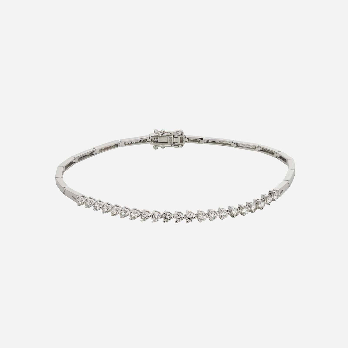tennis diamond bracelet in 18k white gold with a minimalist design and diamond-studded surface.