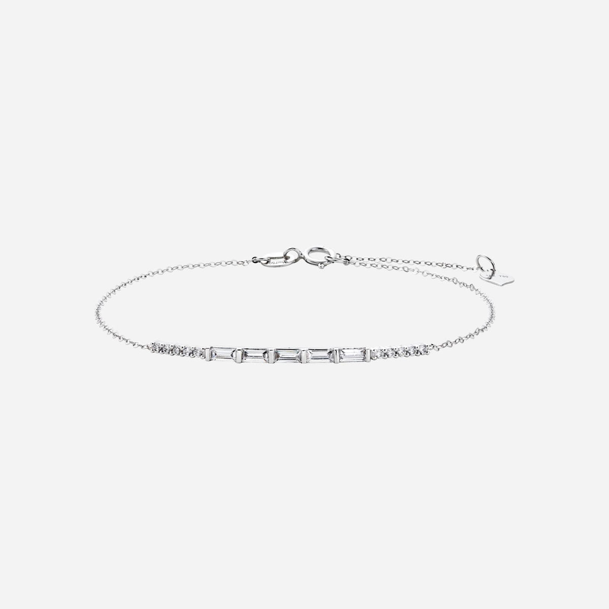baguette diamond bracelet in 18k white gold featuring small round diamonds on each side. elegant bar design.