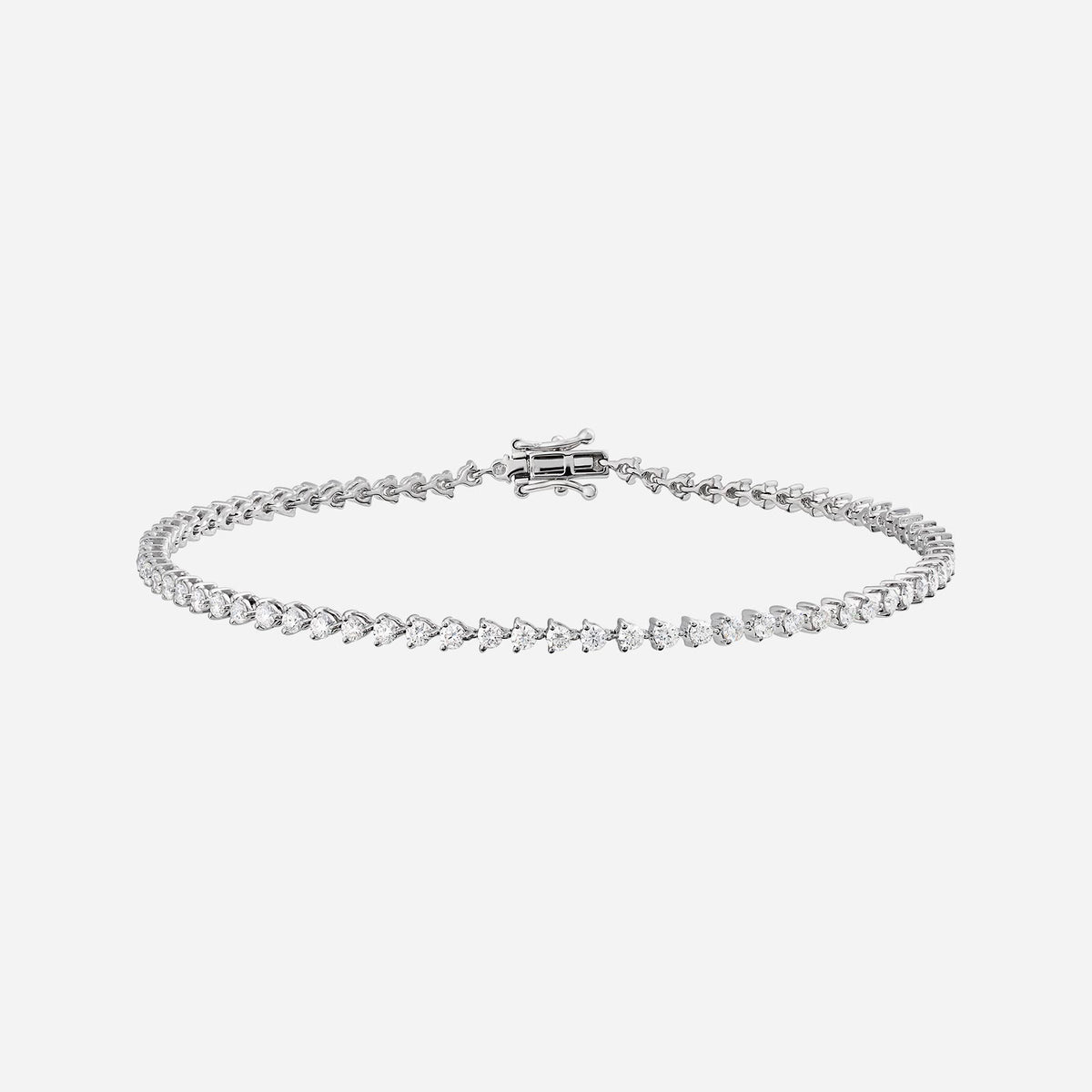 tennis diamond bracelet in 18k white gold featuring flawless diamonds in a classic design.