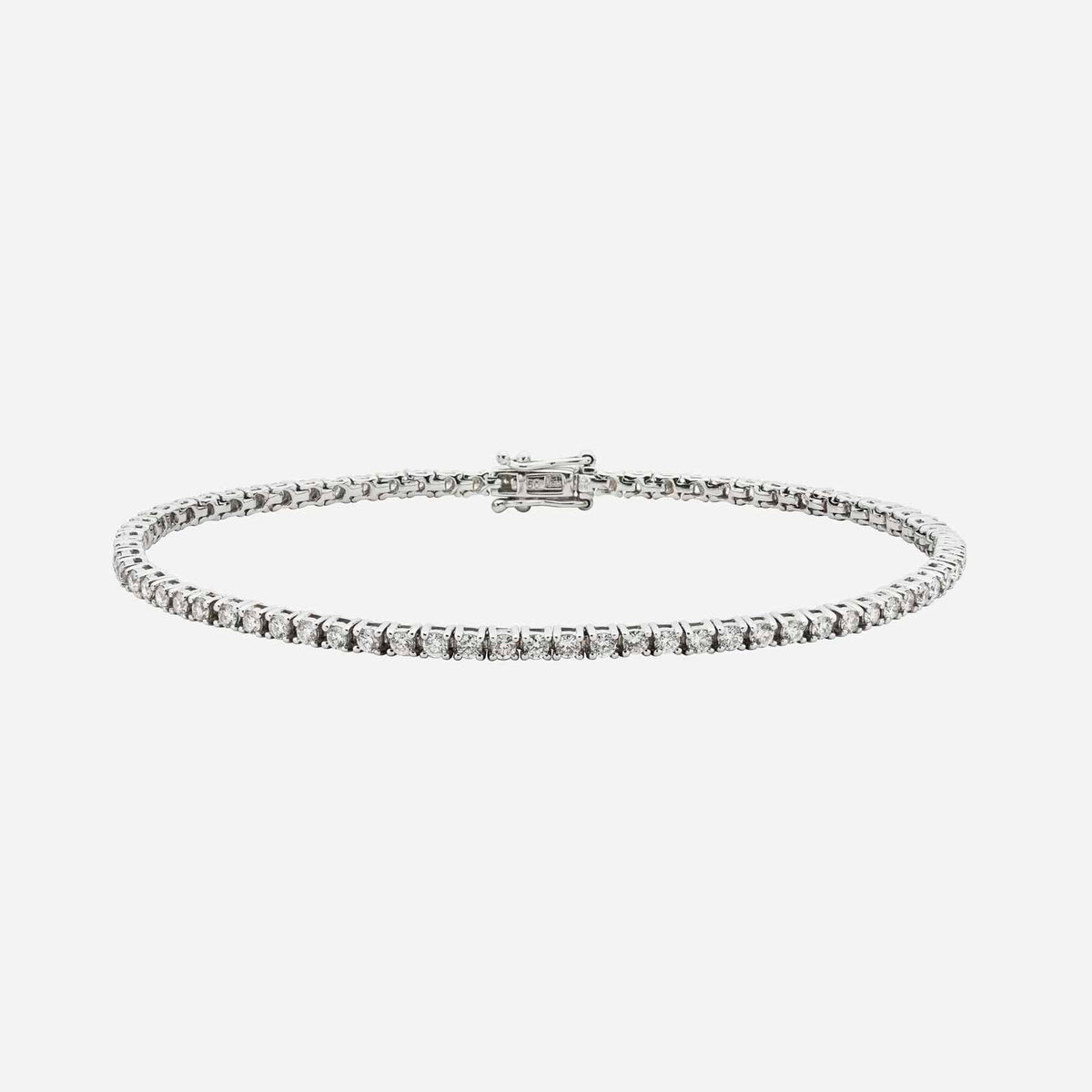 tennis bracelet in 18k white gold featuring a row of dazzling round-cut diamonds with a secure clasp.