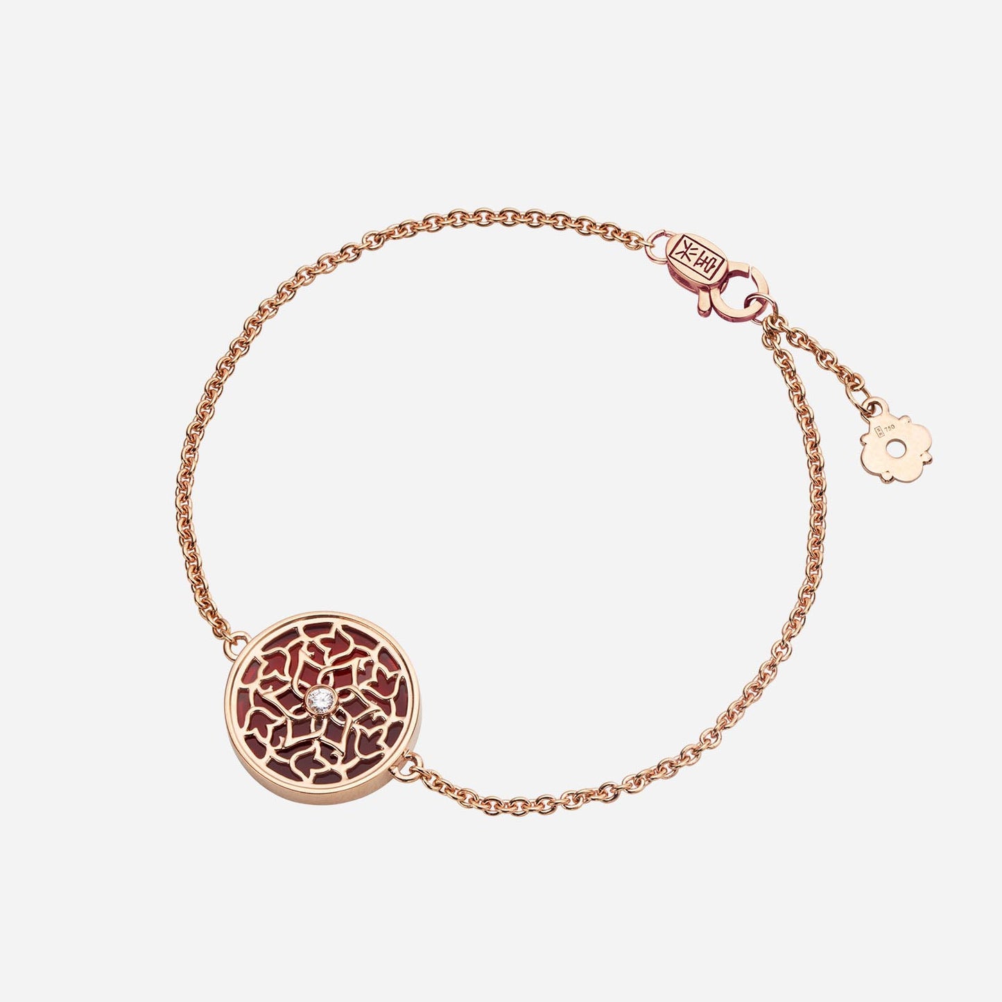legacy bracelet featuring deep red agate and diamond in intricate 18k rose gold floral motif on delicate chain.