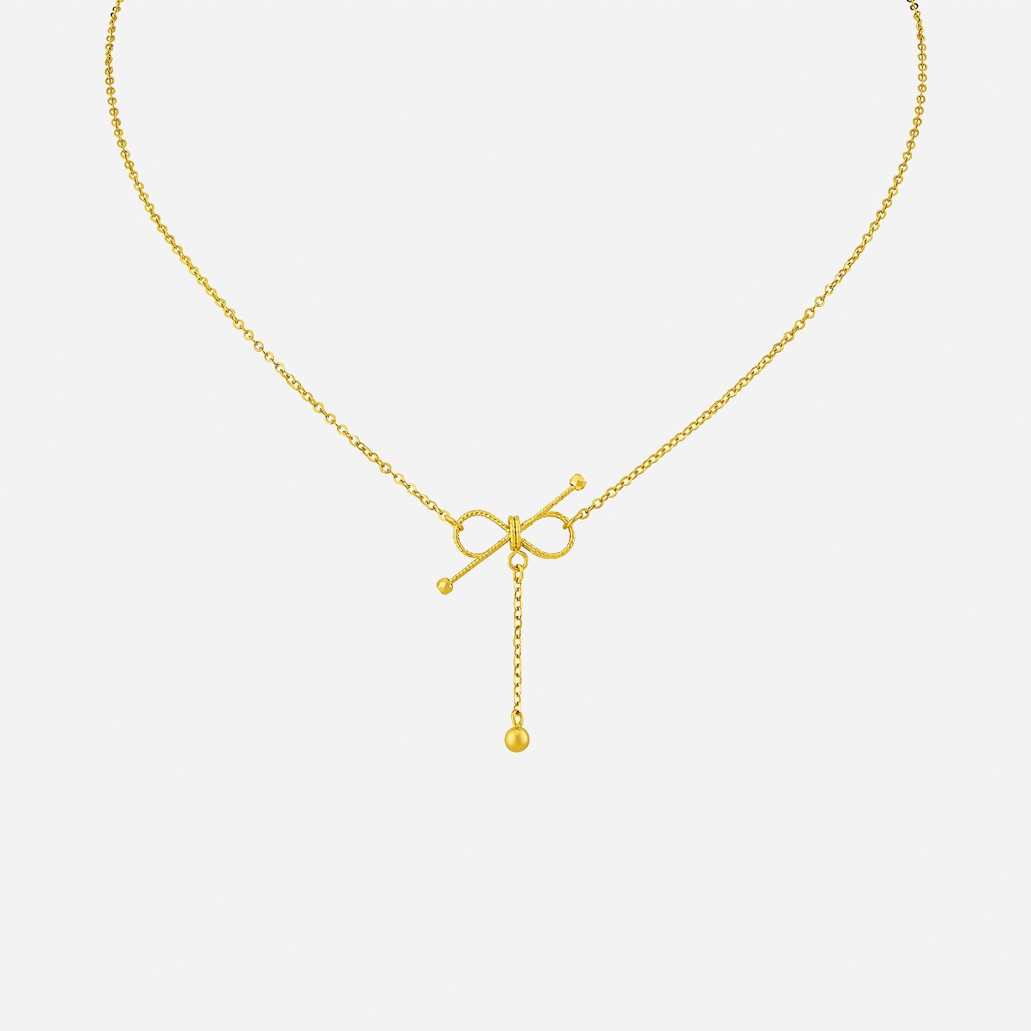 22k yellow gold love knot necklace featuring a delicate knot design with a dangling chain and ball detail.