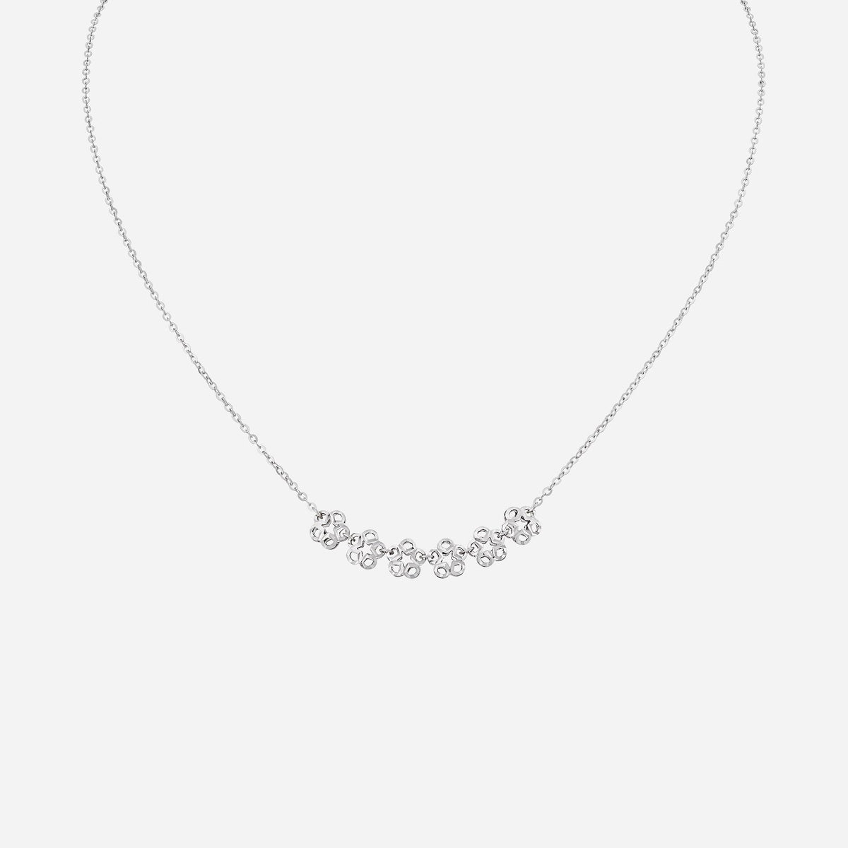 flower necklace crafted from 18k white gold featuring six floral blooms and star accents for a modern elegance.