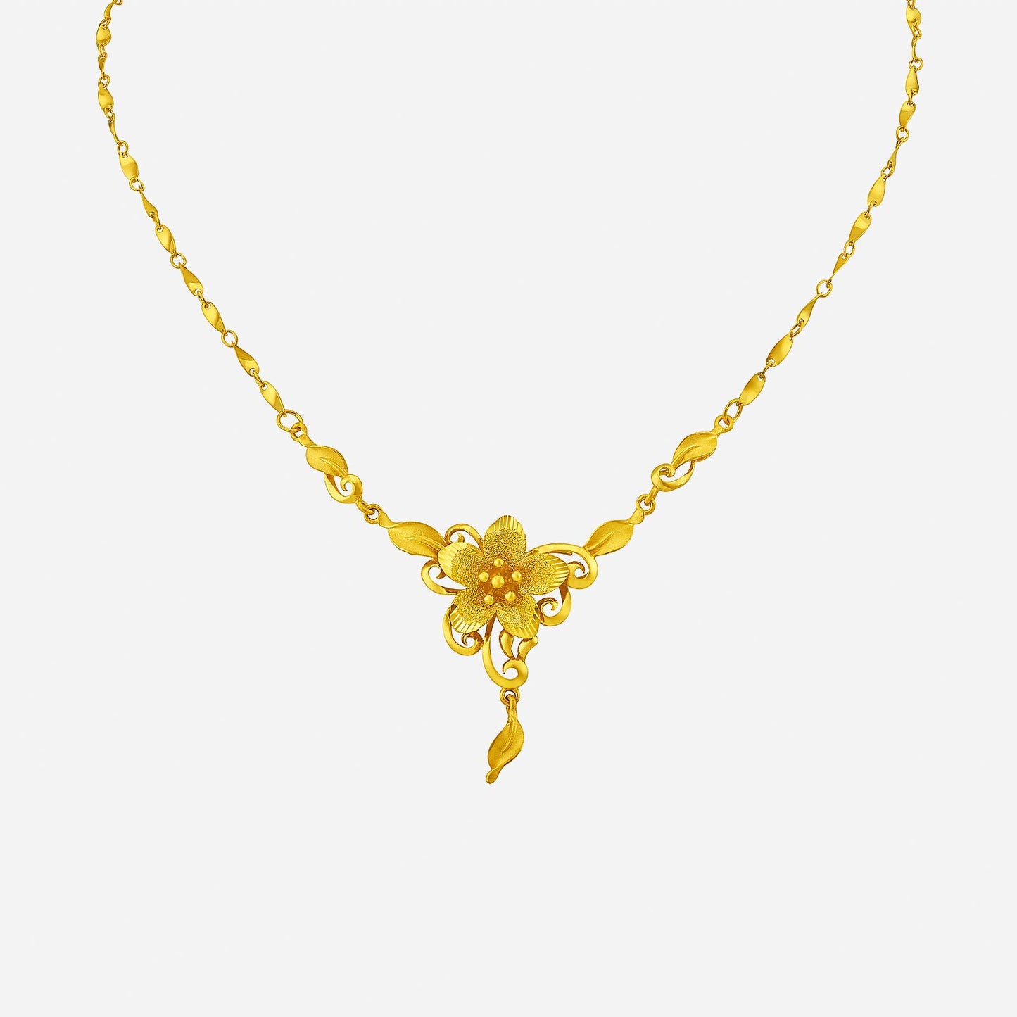 vibrant blossom necklace in 24k yellow gold with floral design and leaf accents, showcasing nature's beauty.