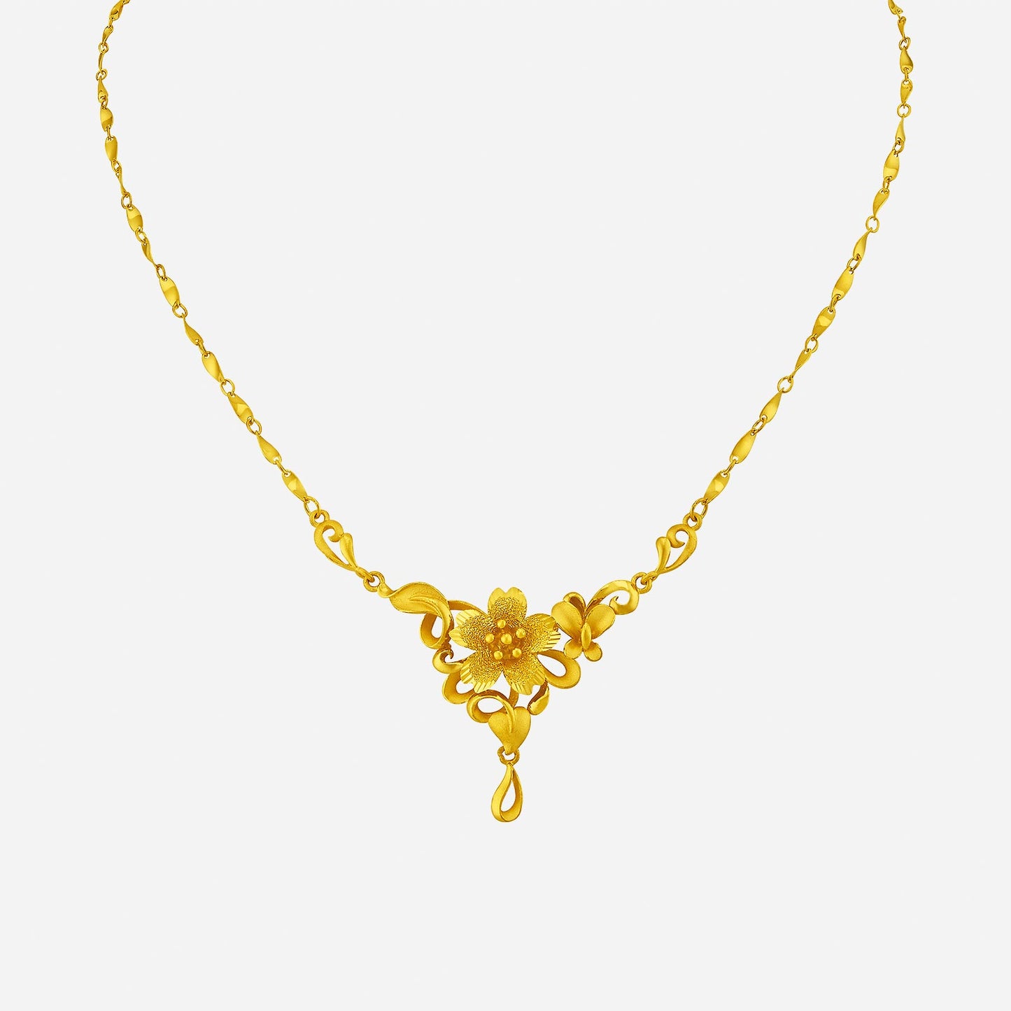 glistening blossom necklace in 24k yellow gold with intricate floral motifs and a teardrop pendant design.