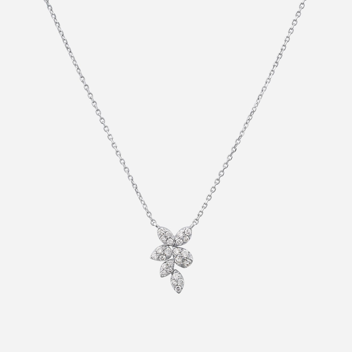 holly stars diamond necklace in 18k white gold with a floral design featuring multiple sparkling gemstones.