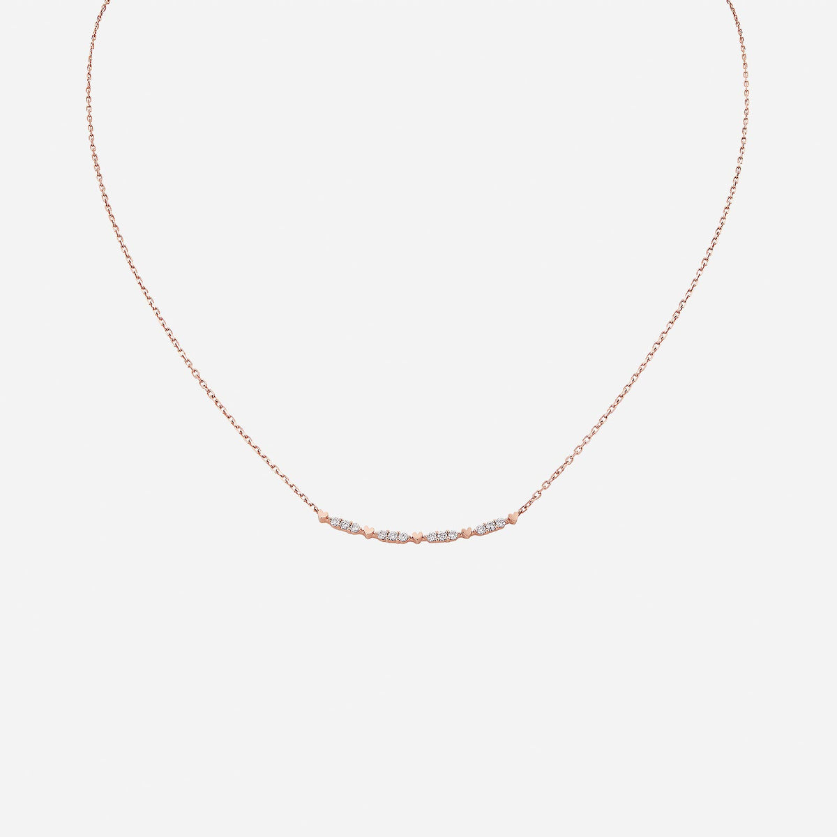 18k rose gold je t’aime necklace featuring delicate hearts and shimmering diamond accents in a stylish design.
