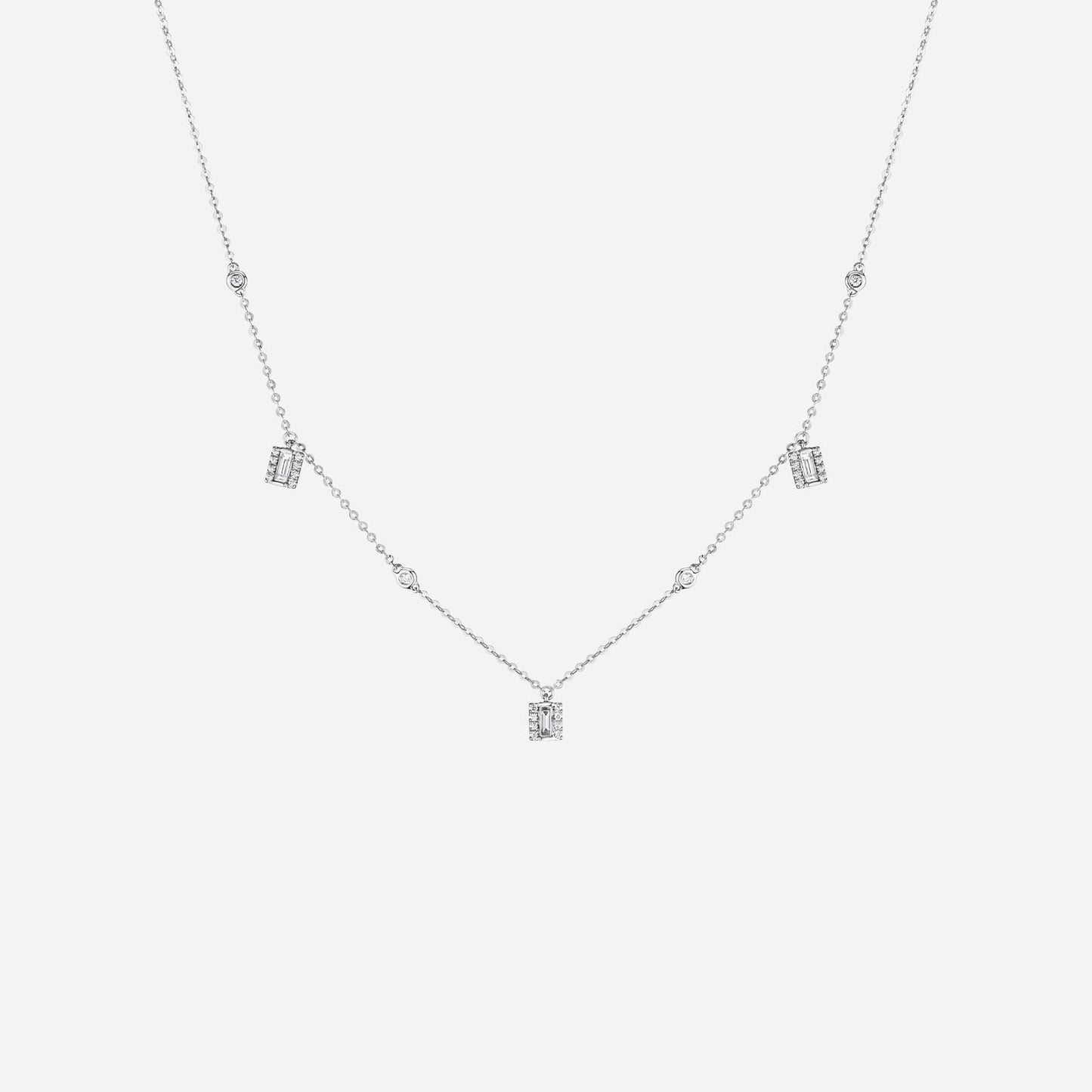 baguette diamond necklace in 18k white gold with four diamond pendants and delicate chain design.