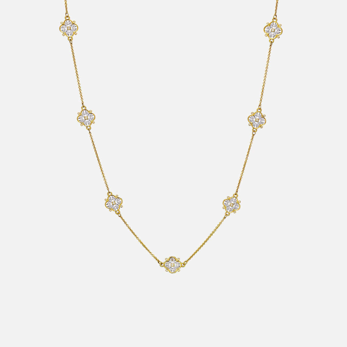 legacy floral long necklace in yellow and white gold with brilliant cut diamond motifs, featuring intricate designs.