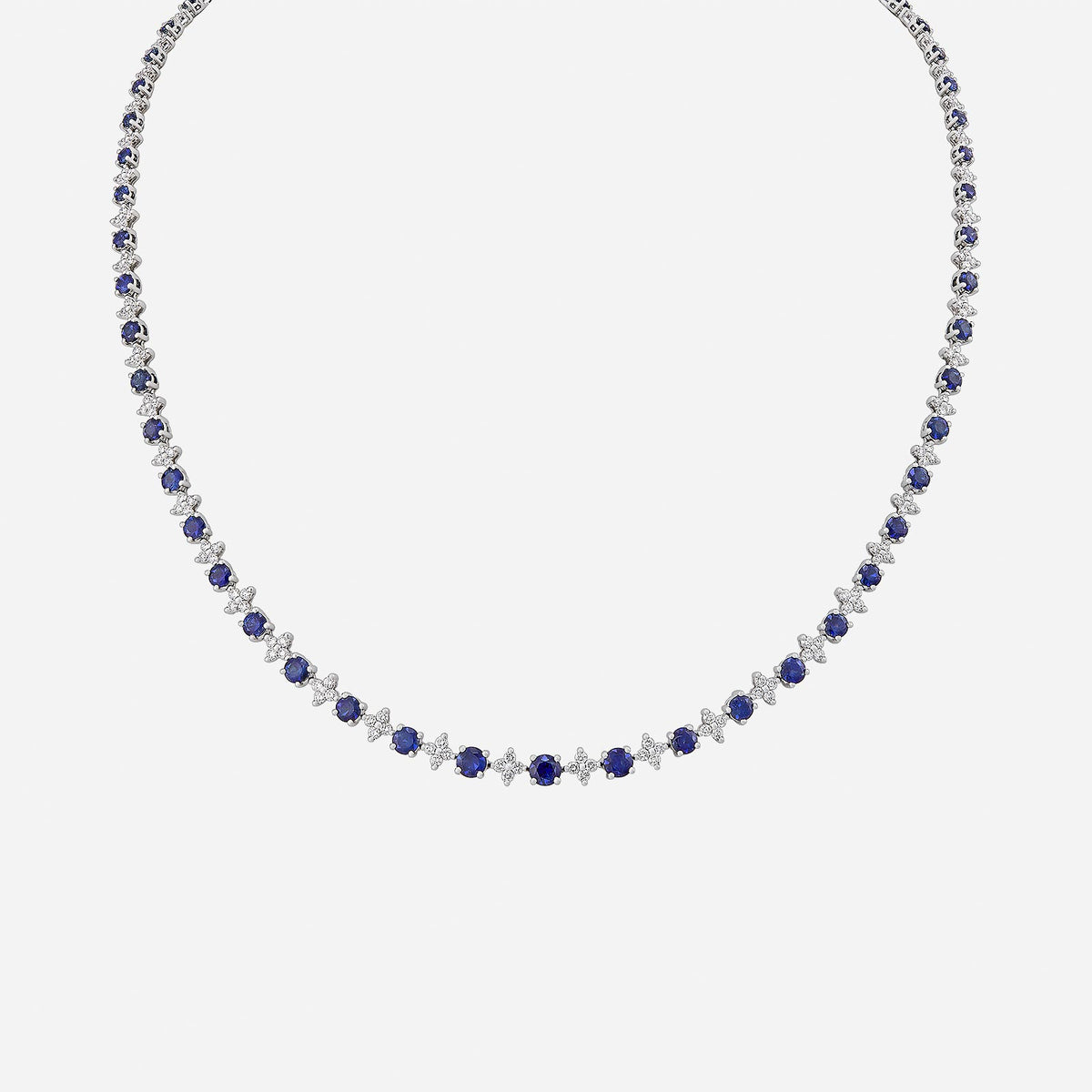 opulent blue sapphire and diamond necklace in 18k white gold with a stunning elegant design.