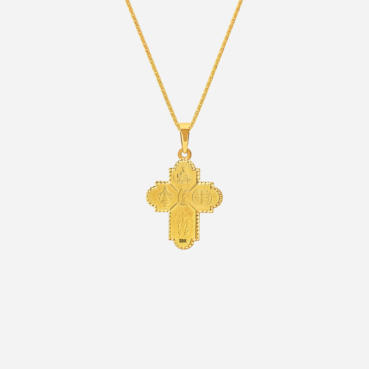 four way cross pendant in 22k yellow gold featuring intricate religious symbols and a central dove of peace design.