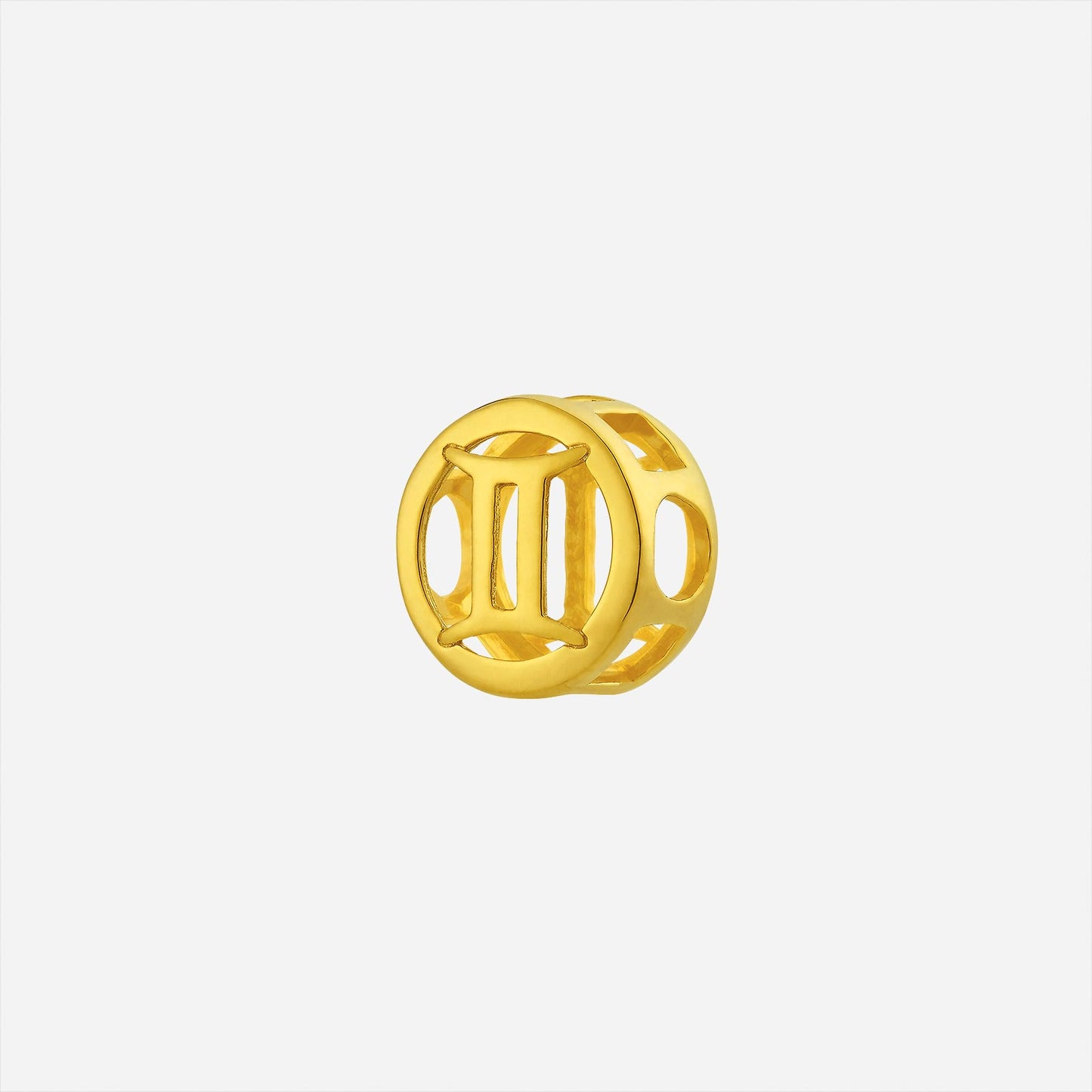 gemini charm pendant in 22k yellow gold with polished circular design and open-cut sides featuring roman numeral ii.