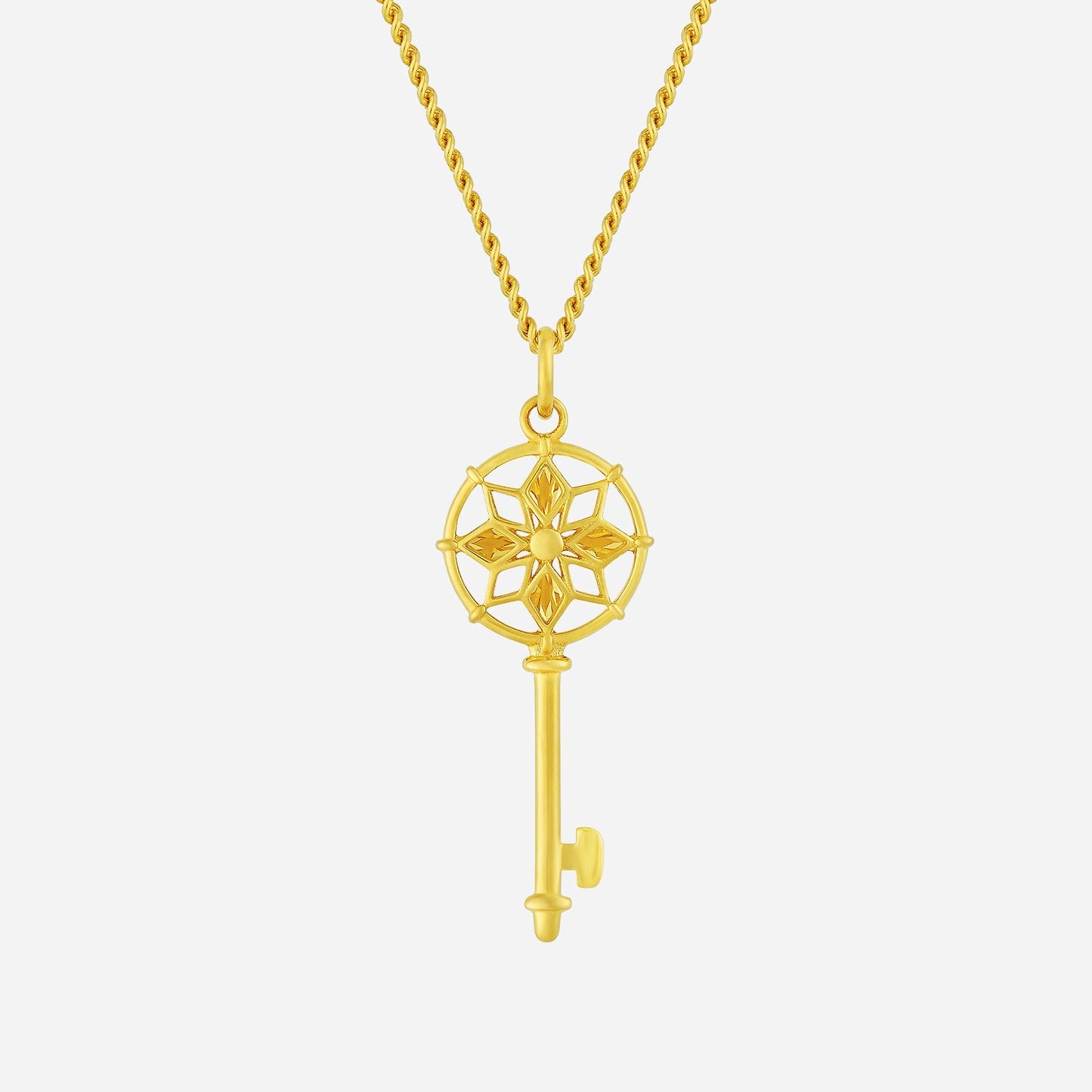 22k yellow gold stellar key pendant featuring intricate star design, elegant chain, and timeless charm.