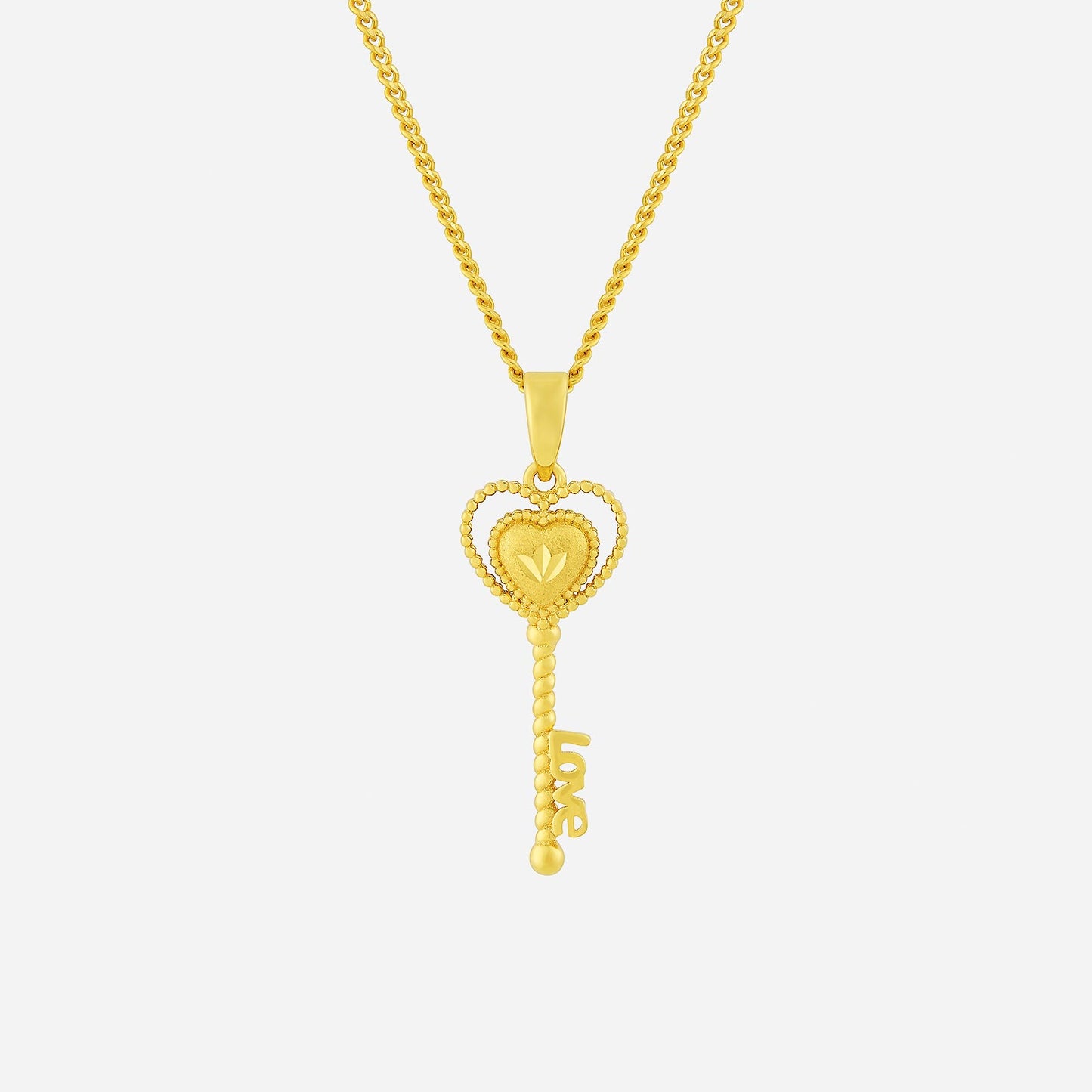 key pendant in 22k yellow gold featuring a heart and "love" inscription, beautifully designed for a timeless look.