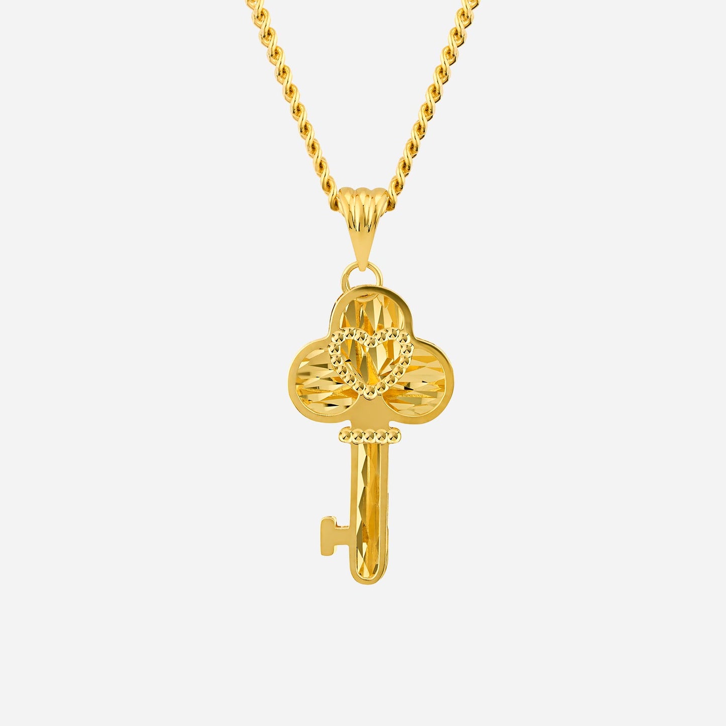 22k yellow gold key pendant with an intricate heart design, perfect for milestone celebrations. chain not included.