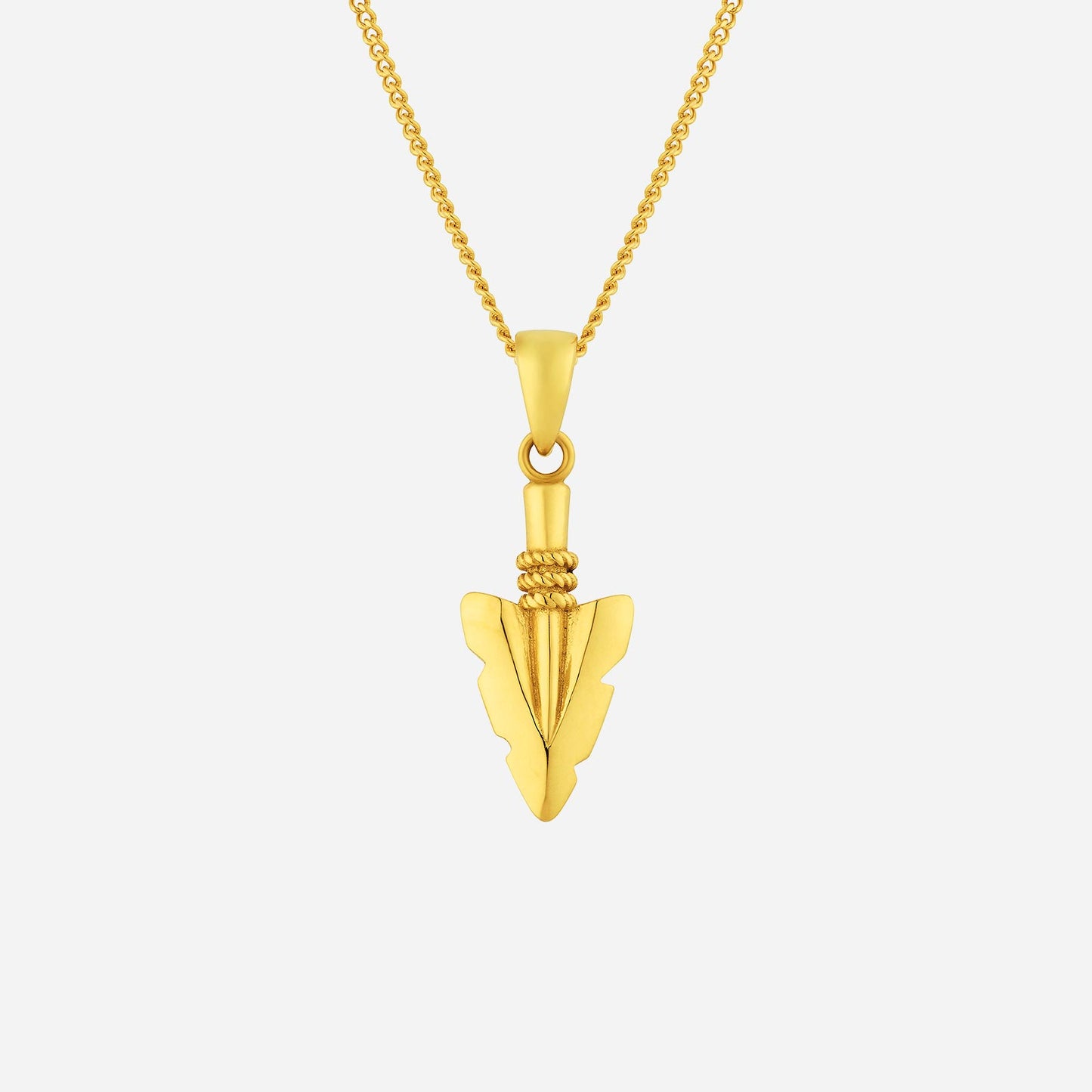 arrowhead pendant in 22k yellow gold with intricate design, symbolizing strength and determination. ideal for layering.