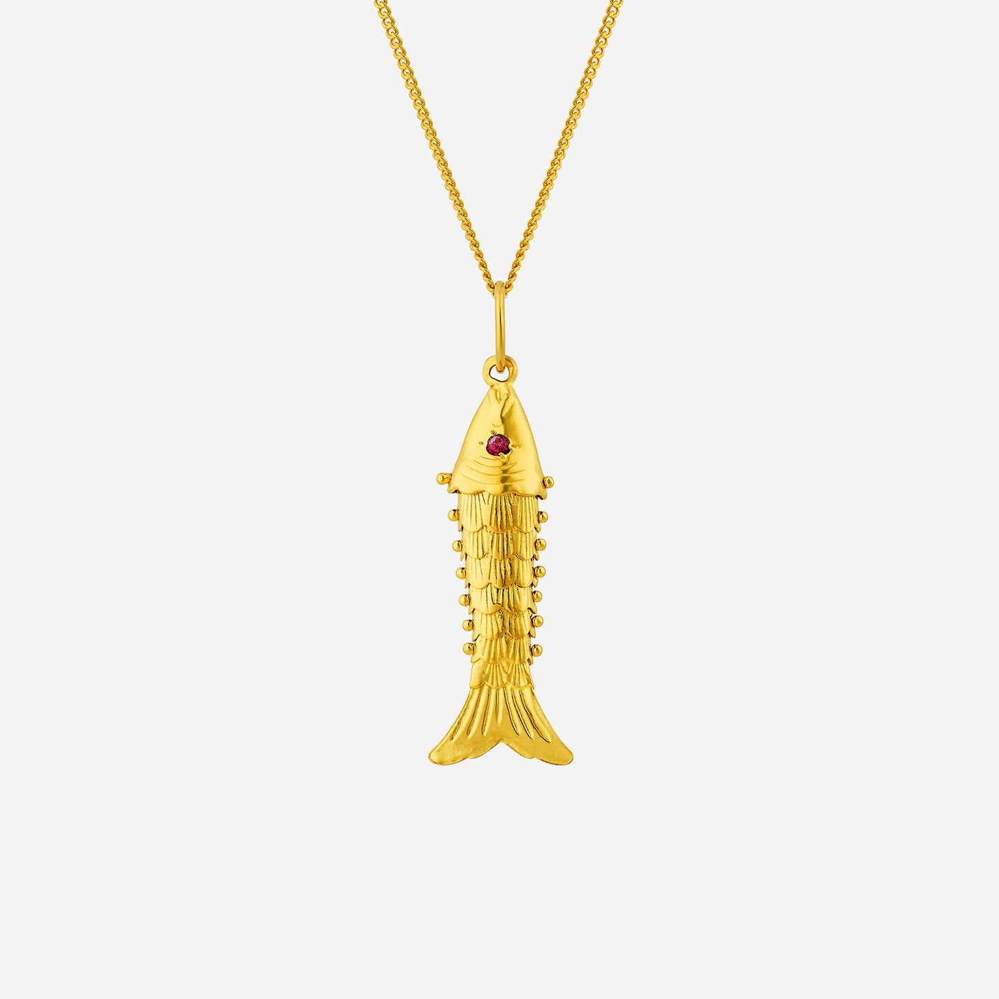 affluence golden fish pendant in 22k yellow gold with intricate detailing and a ruby gemstone accent.