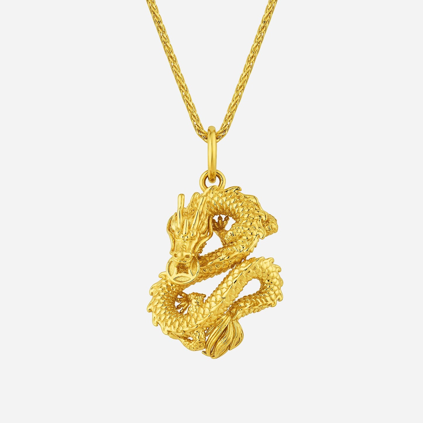 dragon pendant in 22k yellow gold, featuring intricate dragon design and detailed scales. chain not included.