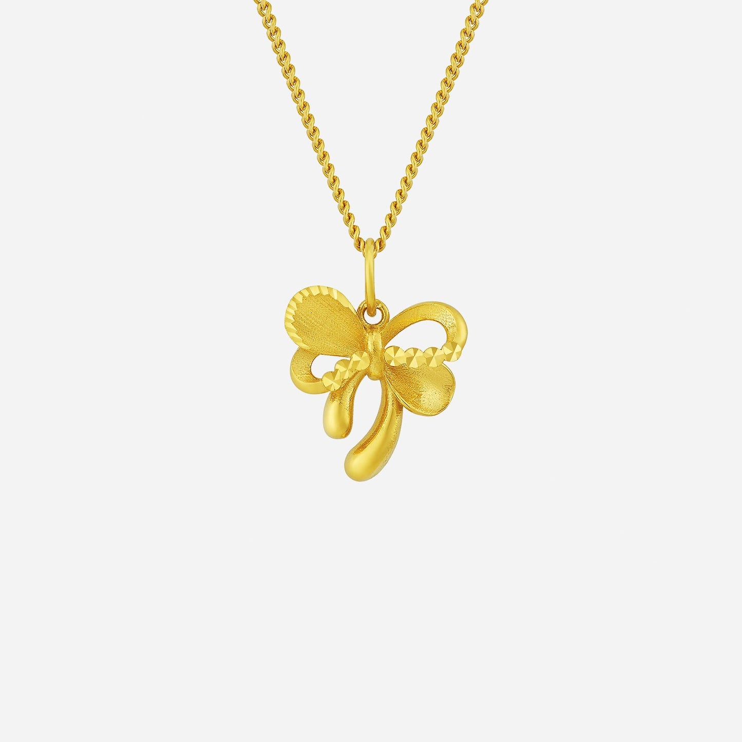 22k yellow gold velvety ribbon pendant featuring an intricate design, perfect for elegant accessorizing.
