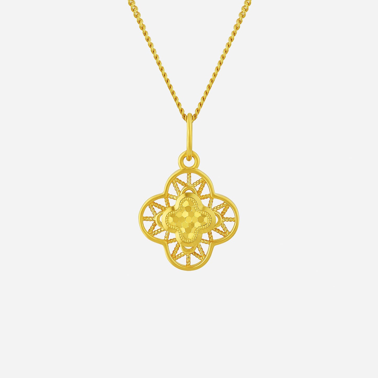 glittering clover pendant crafted in 22k yellow gold with intricate lace design and polished central motif.