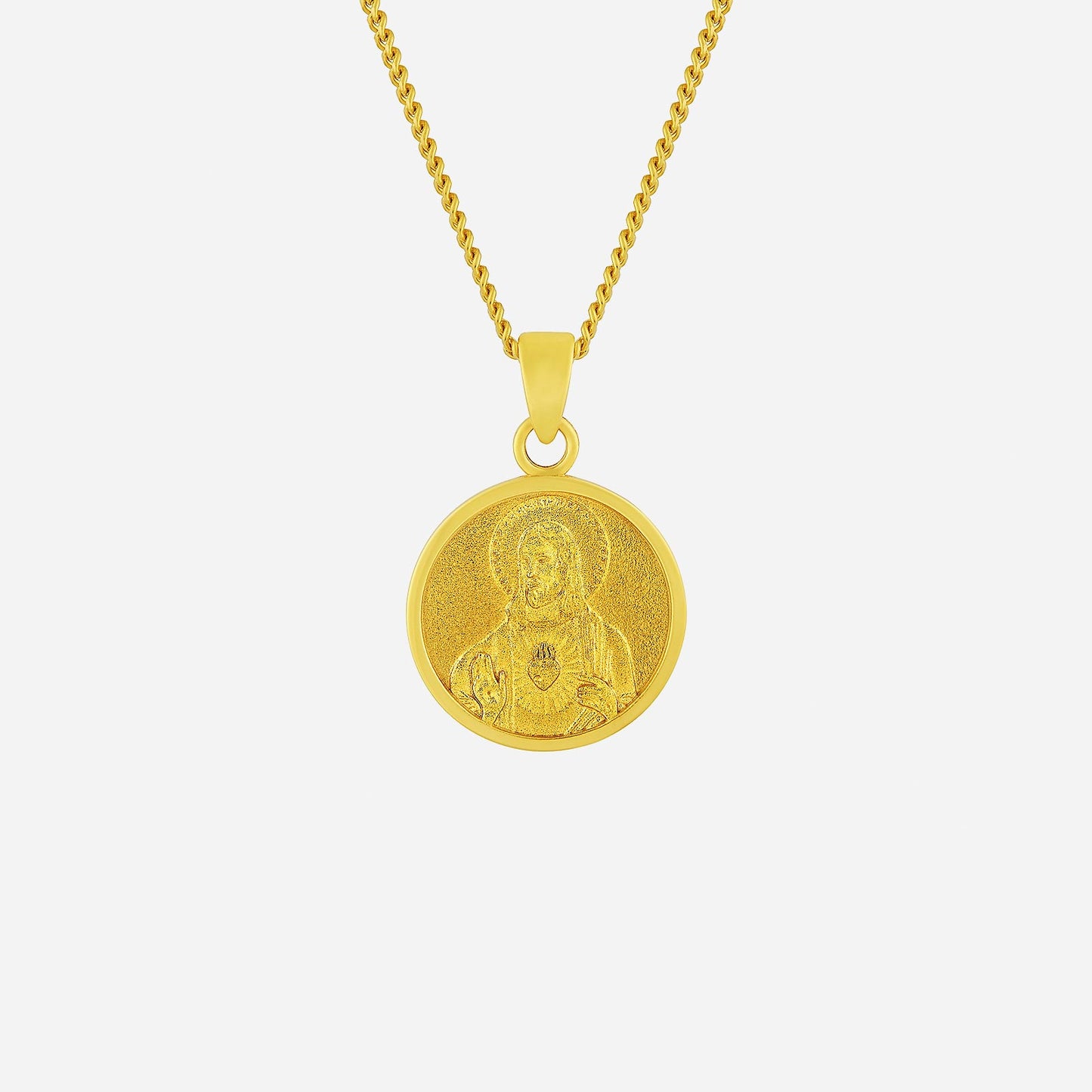 sacred heart pendant in 22k yellow gold with intricate detailing; features a religious figure and textured design.
