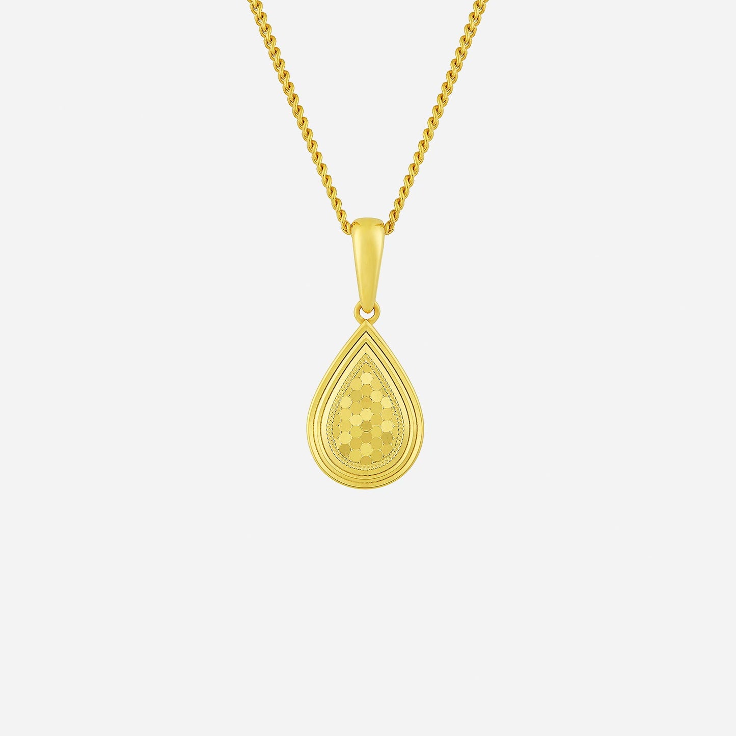 glittering teardrop pendant in yellow gold with intricate detailing, perfect for adding shine to any outfit.