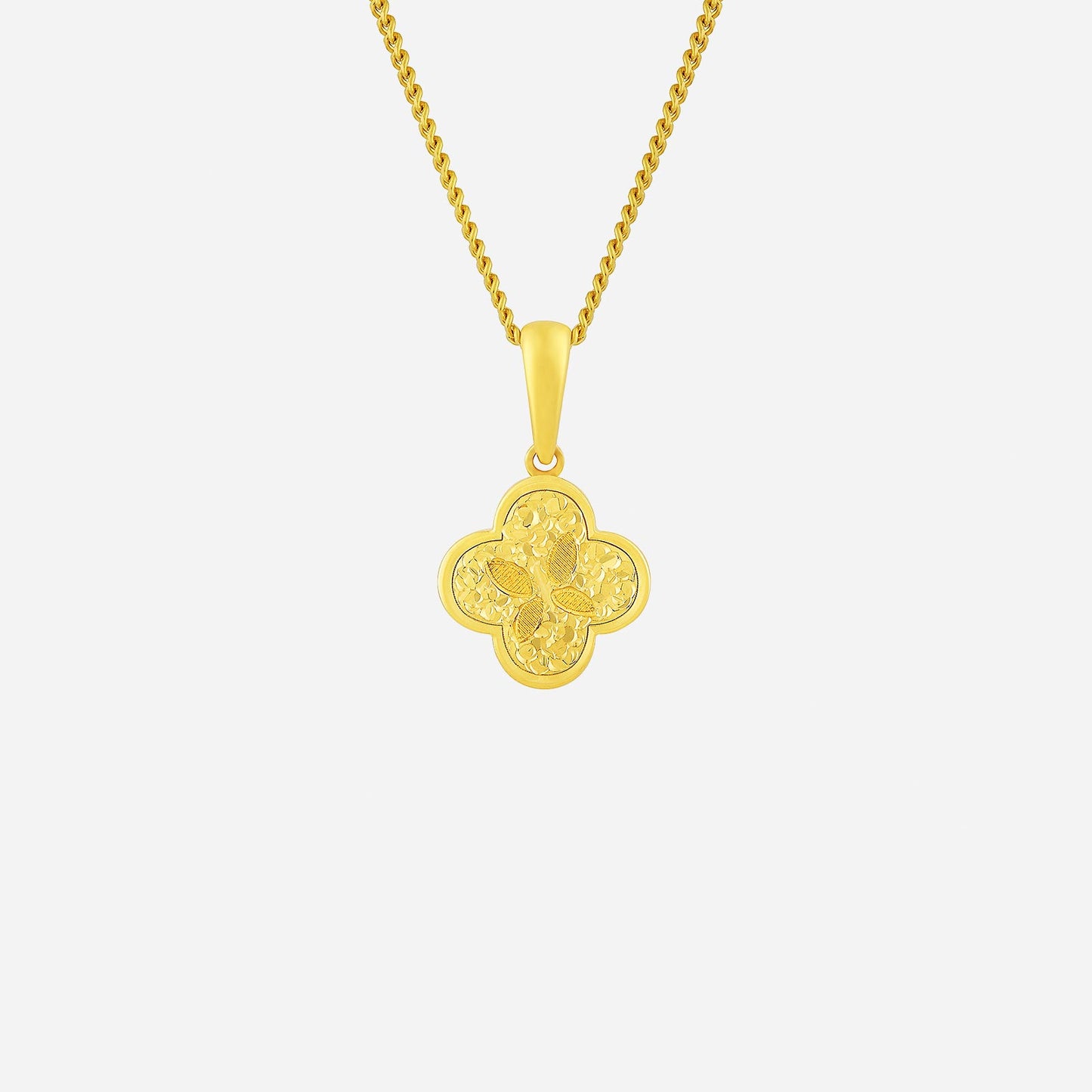 glittering clover pendant in 22k yellow gold with intricate floral design, ideal for adding charm to contemporary looks.