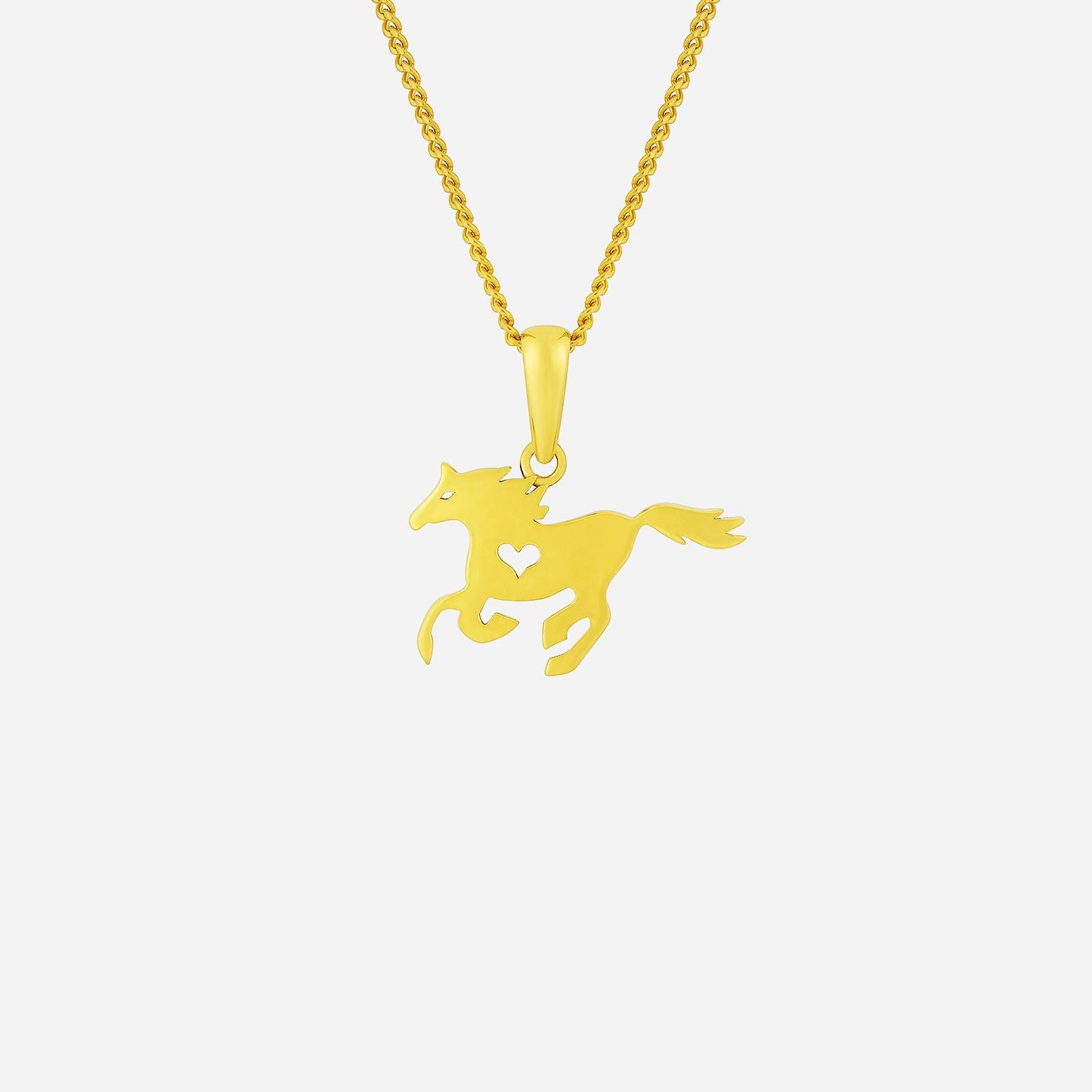 galloping horse pendant in 22k yellow gold with heart cutout design, symbolizing freedom and determination.