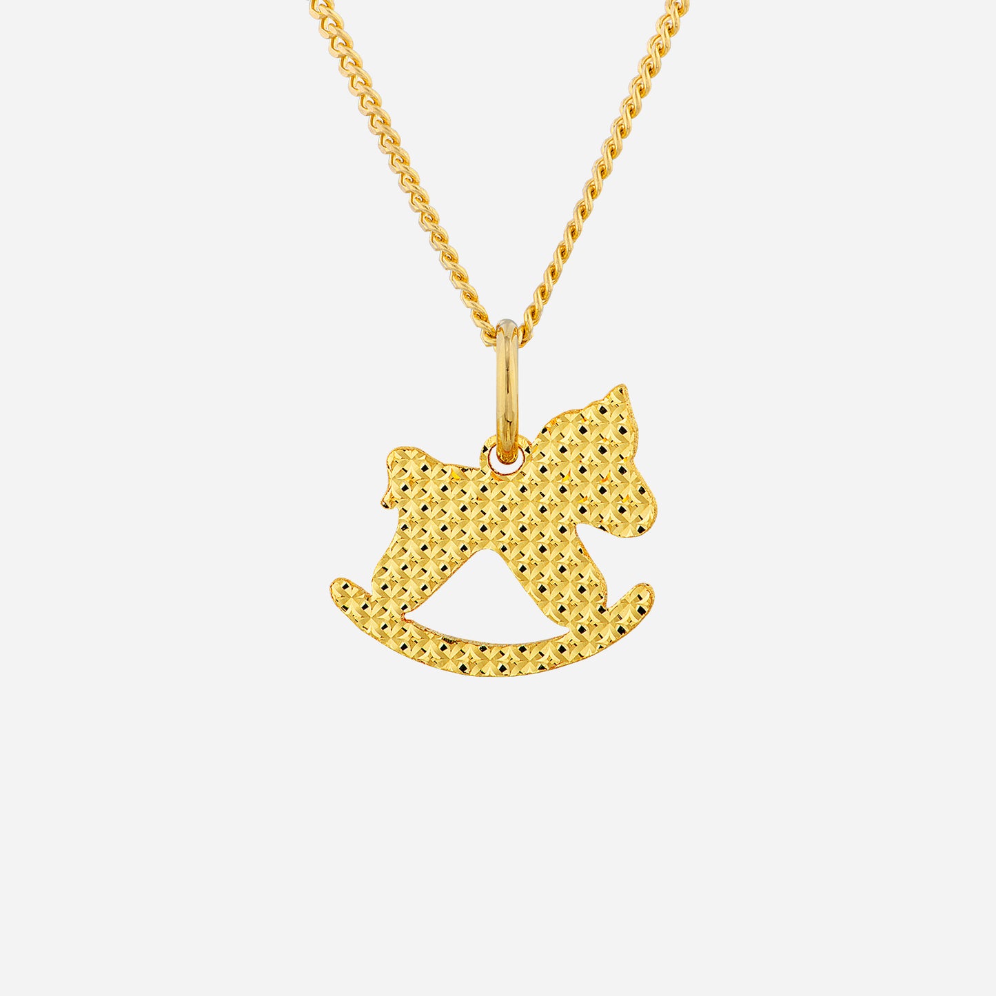 glittering pony pendant in 22k yellow gold with a shimmering diamond-cut texture and playful rocking-horse design.