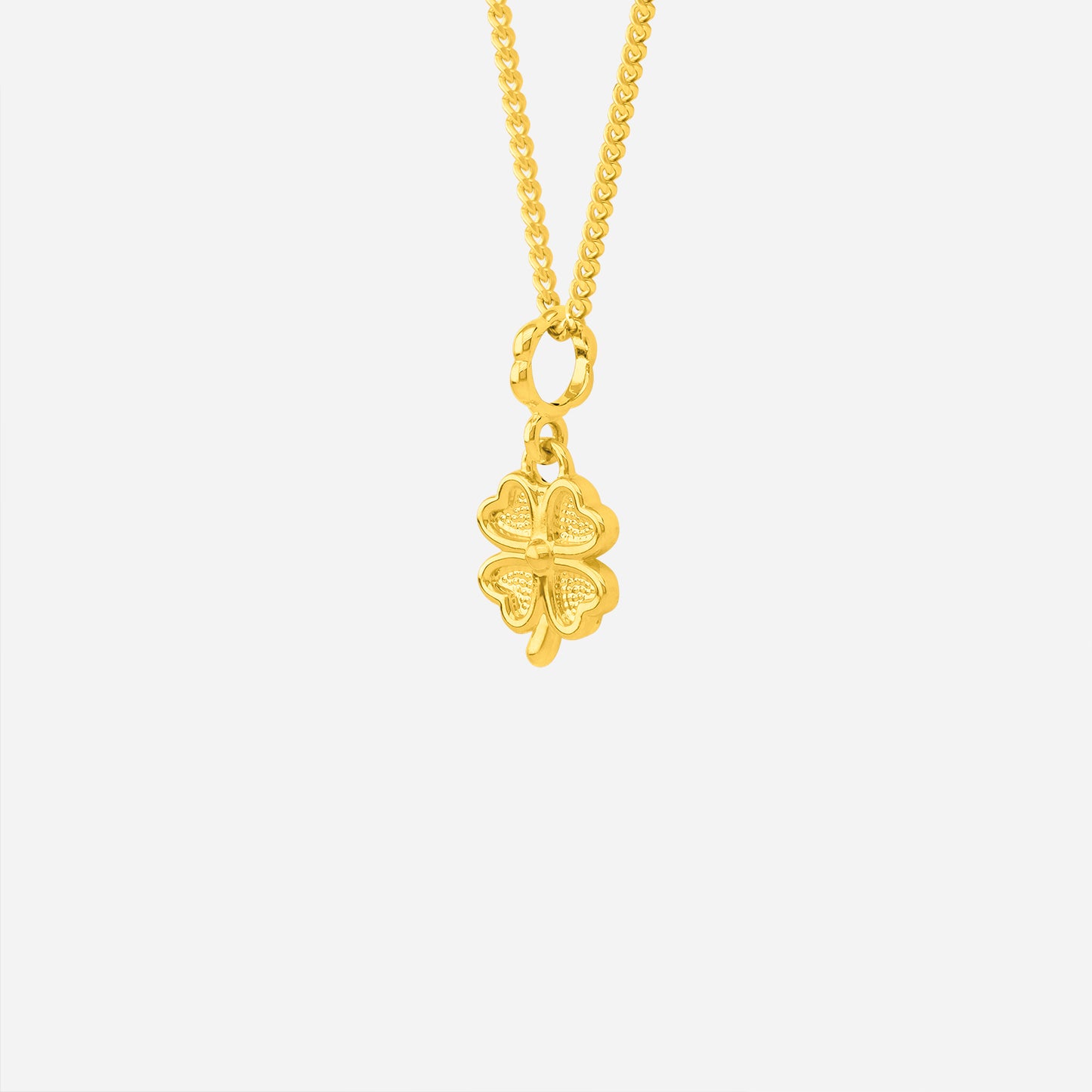 clover pendant in 22k yellow gold with a sculpted four-leaf design and refined textures, perfect for everyday wear.