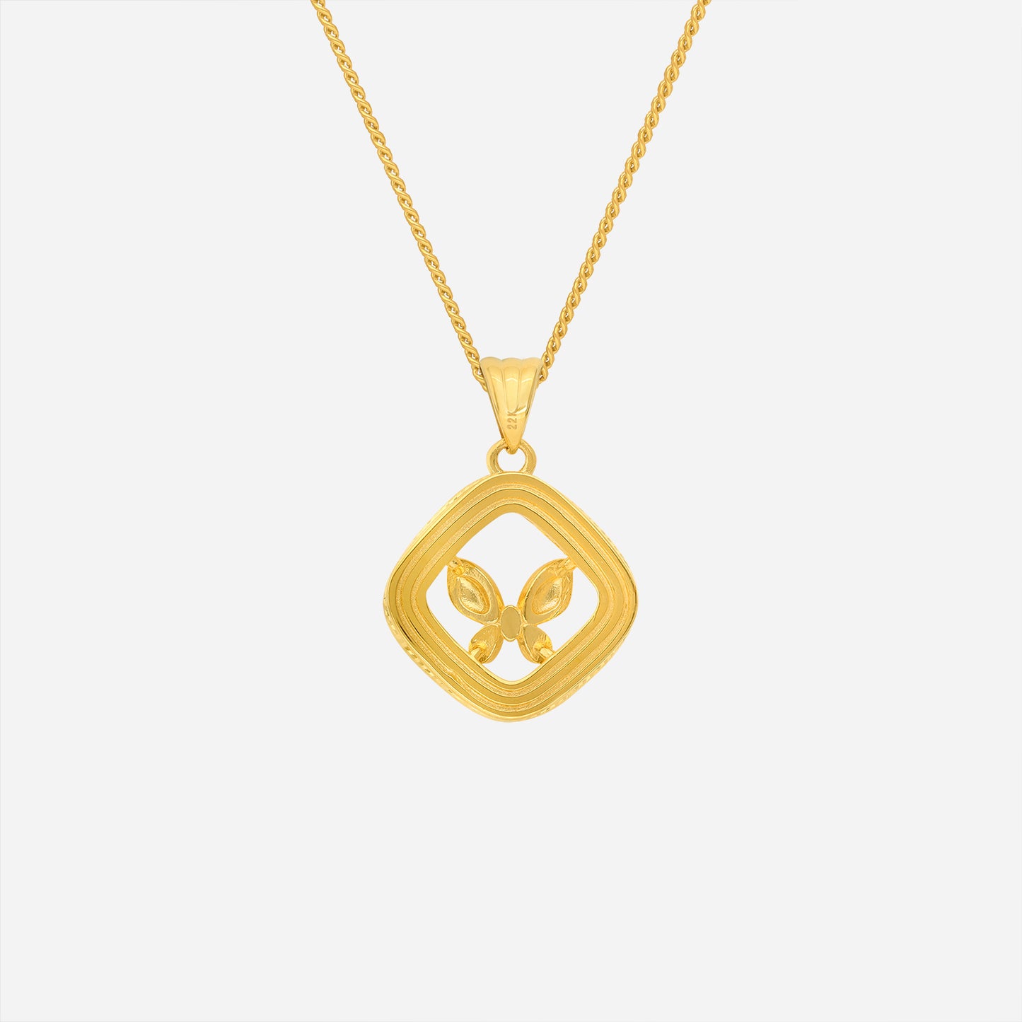 butterfly pendant in 22k yellow gold with sculpted geometric outline and dimensional butterfly motif.