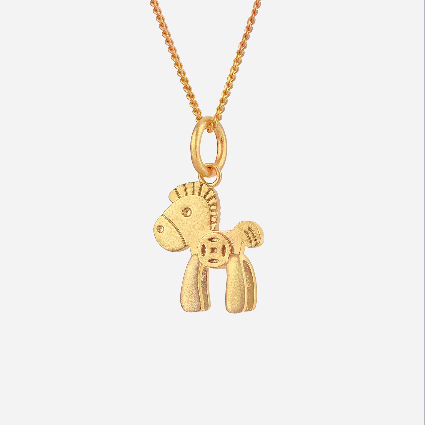 horse pendant in 22k yellow gold with rounded details, showcasing a cute stylized horse design.
