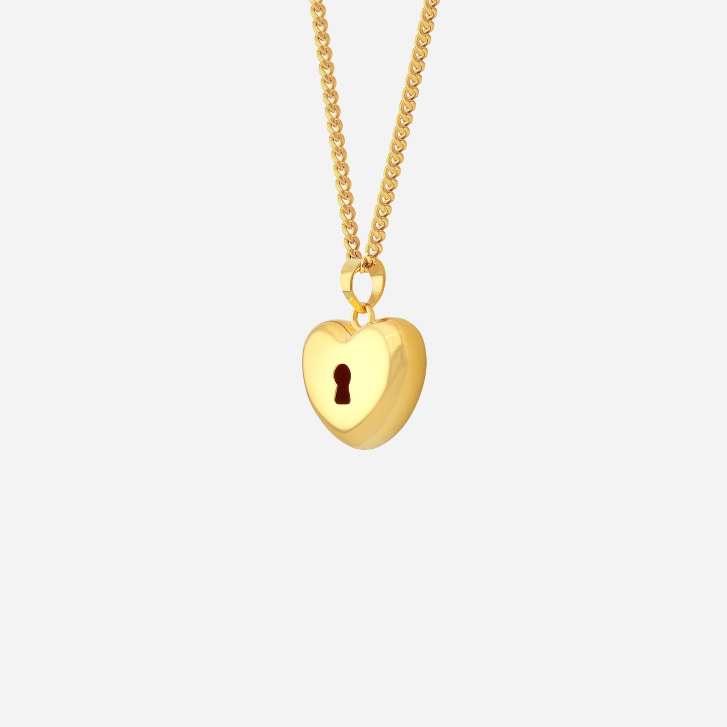 heart-shaped pendant in 22k yellow gold with a keyhole detail, hanging from a delicate chain.