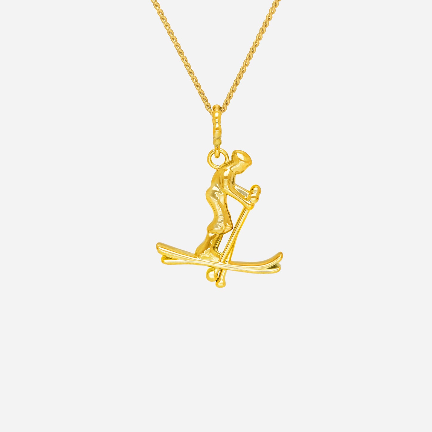 ace of skiing pendant in 22k yellow gold featuring a dynamic skier in motion, perfect for sports enthusiasts.