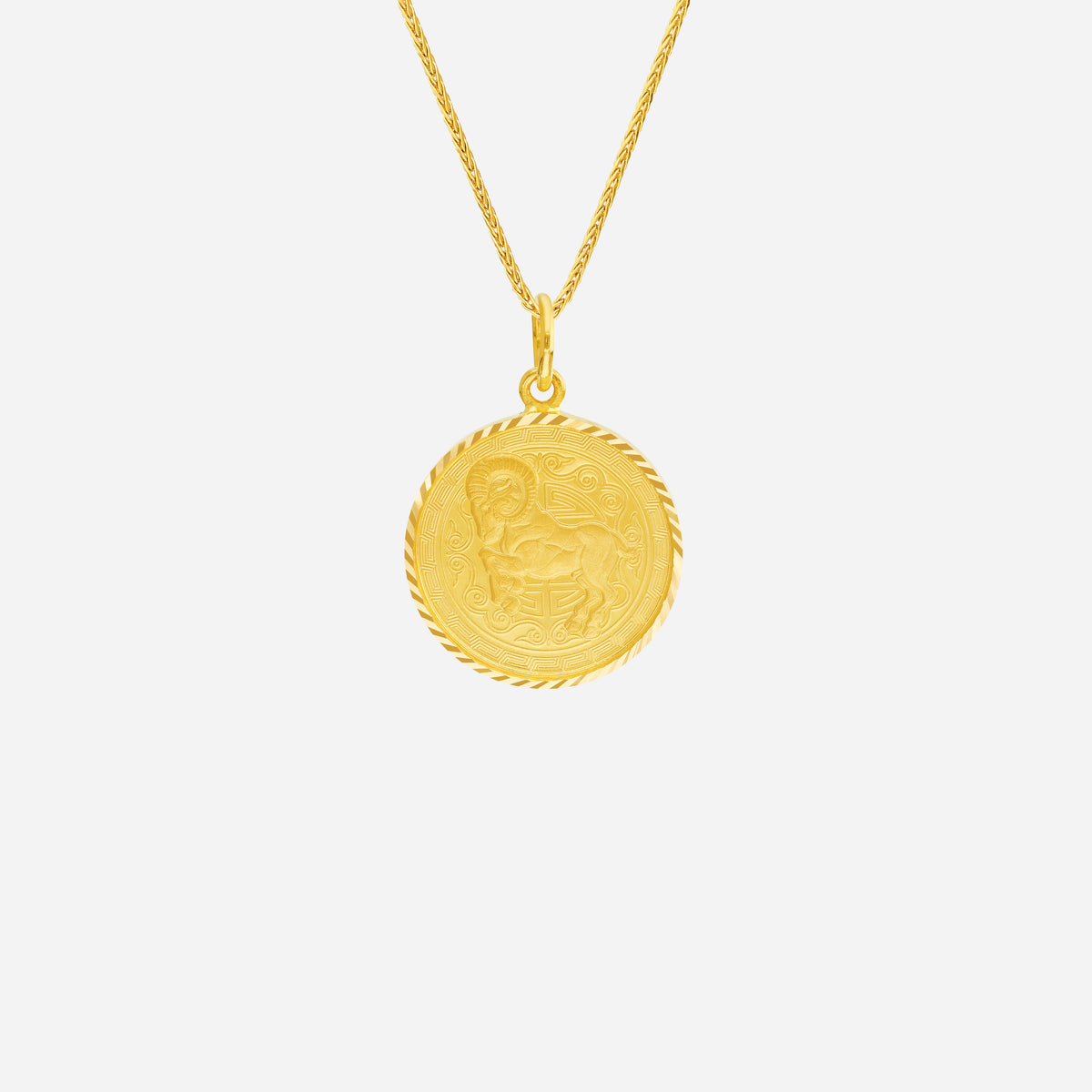 prosperity goat pendant in 22k yellow gold featuring intricate goat design and twisted rope edge.