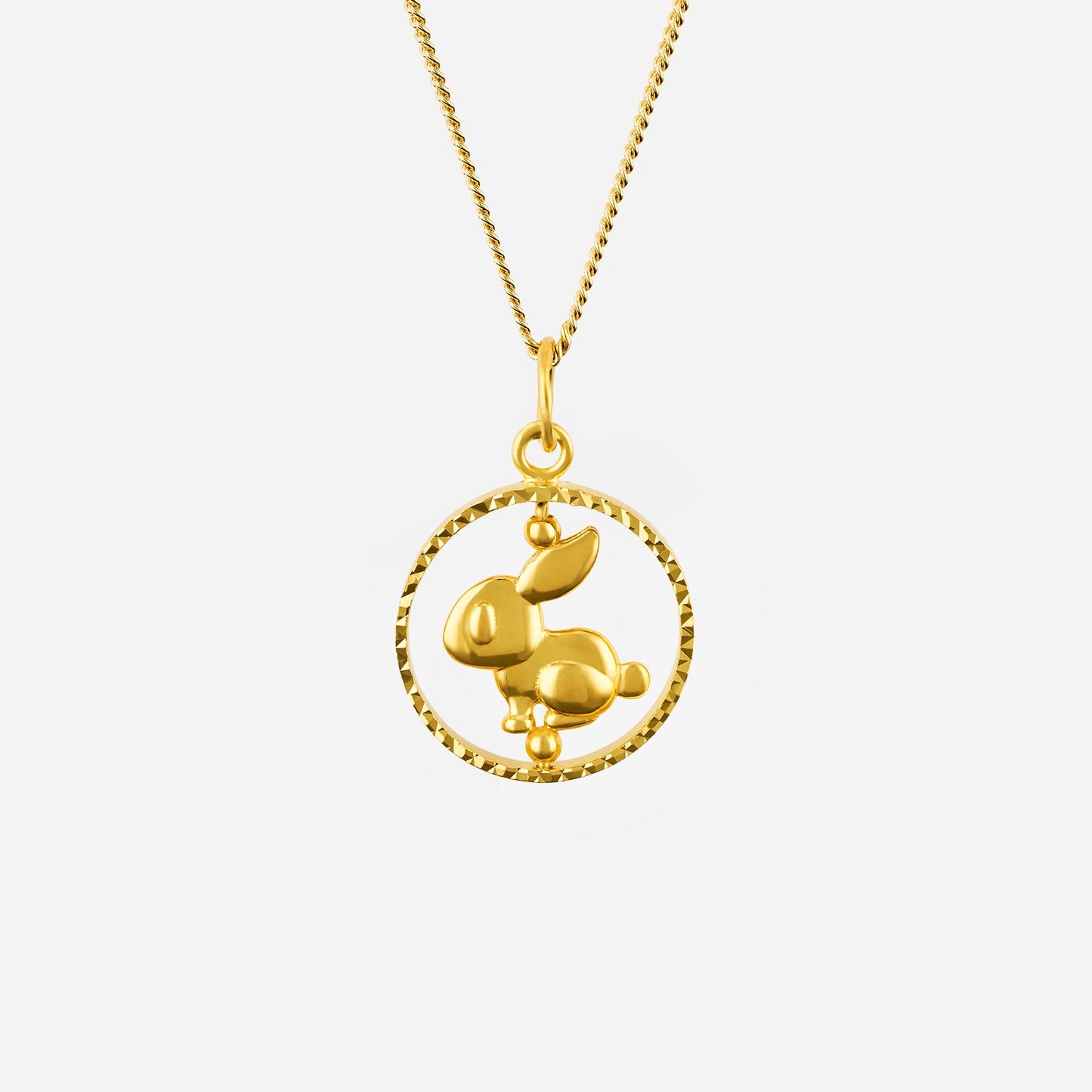 22k yellow gold rabbit pendant with a circular design and polished finish, symbolizing gentleness and luck.