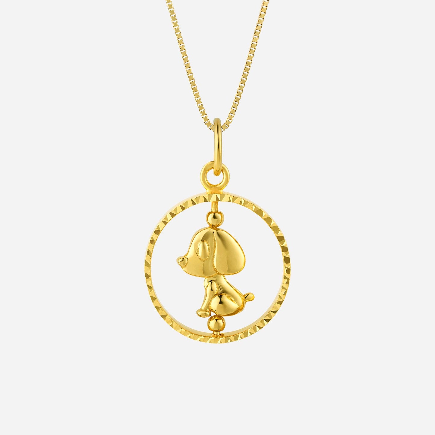 dog pendant in 22k yellow gold featuring a spinning design within a circular frame. whimsical puppy charm for good luck.