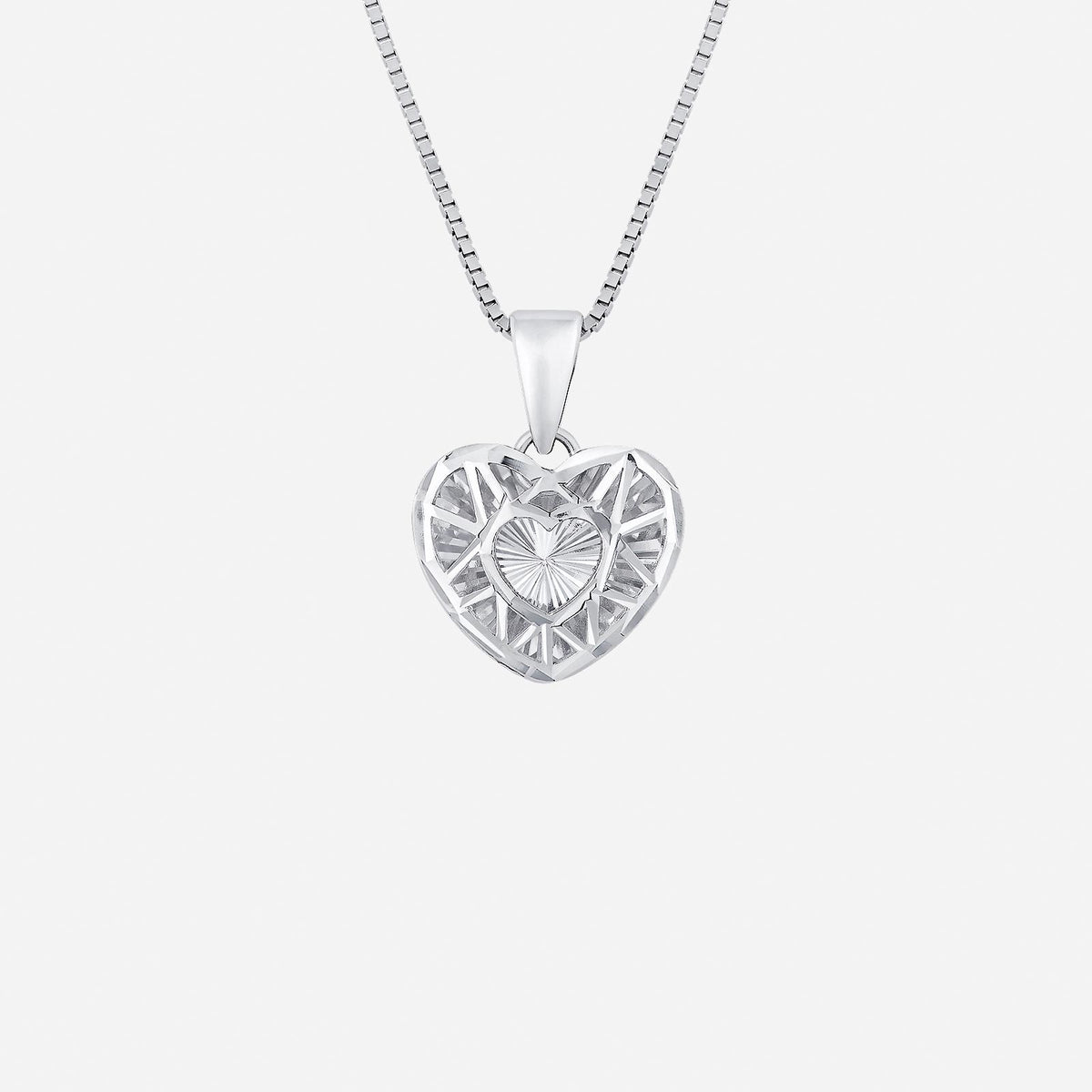 heart shaped pendant in 18k white gold with intricate light-reflecting design and central heart detail. chain sold separately.