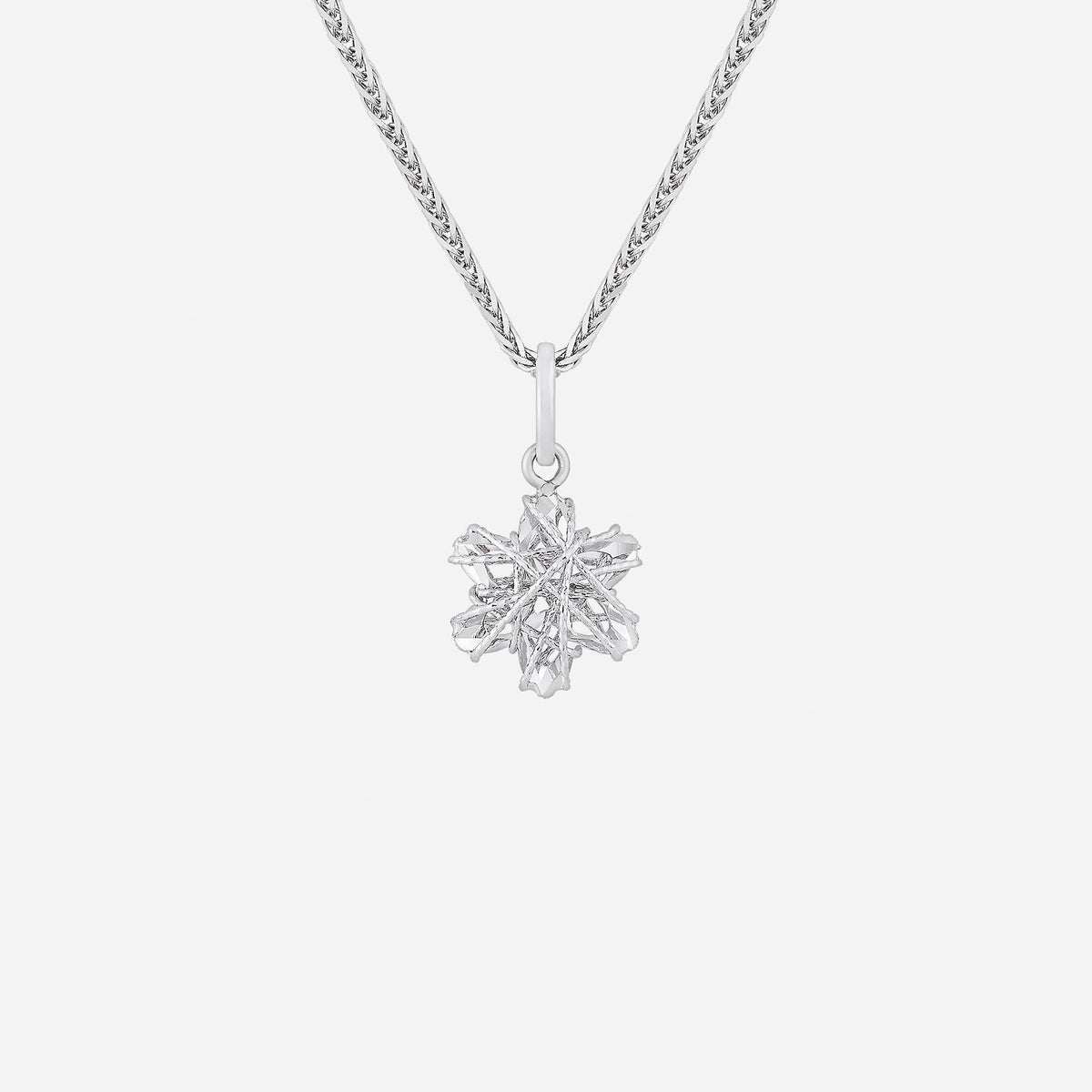 sparkling white gold star pendant with intricate design, elegant and versatile for any occasion. chain not included.