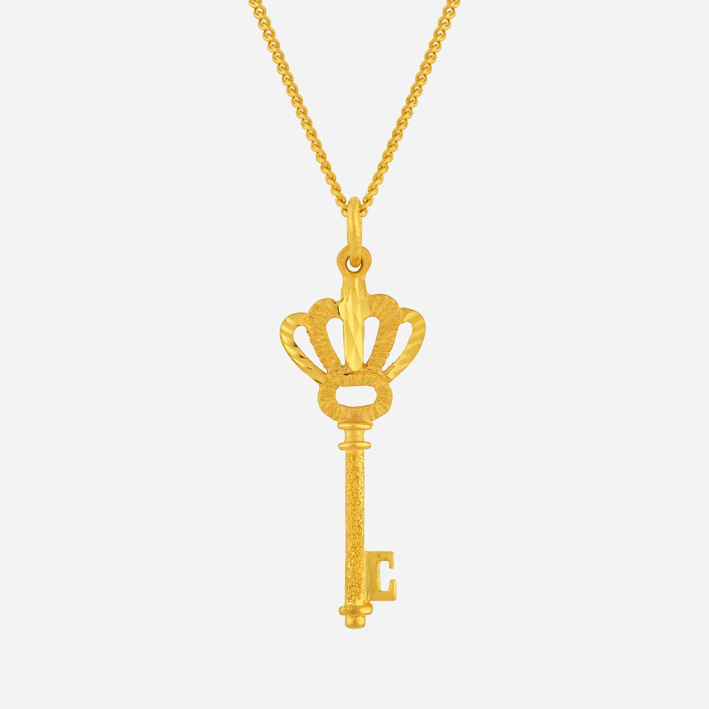 key pendant in 24k yellow gold with ornate crown design and textured finish, symbolizing elegance and mystery.