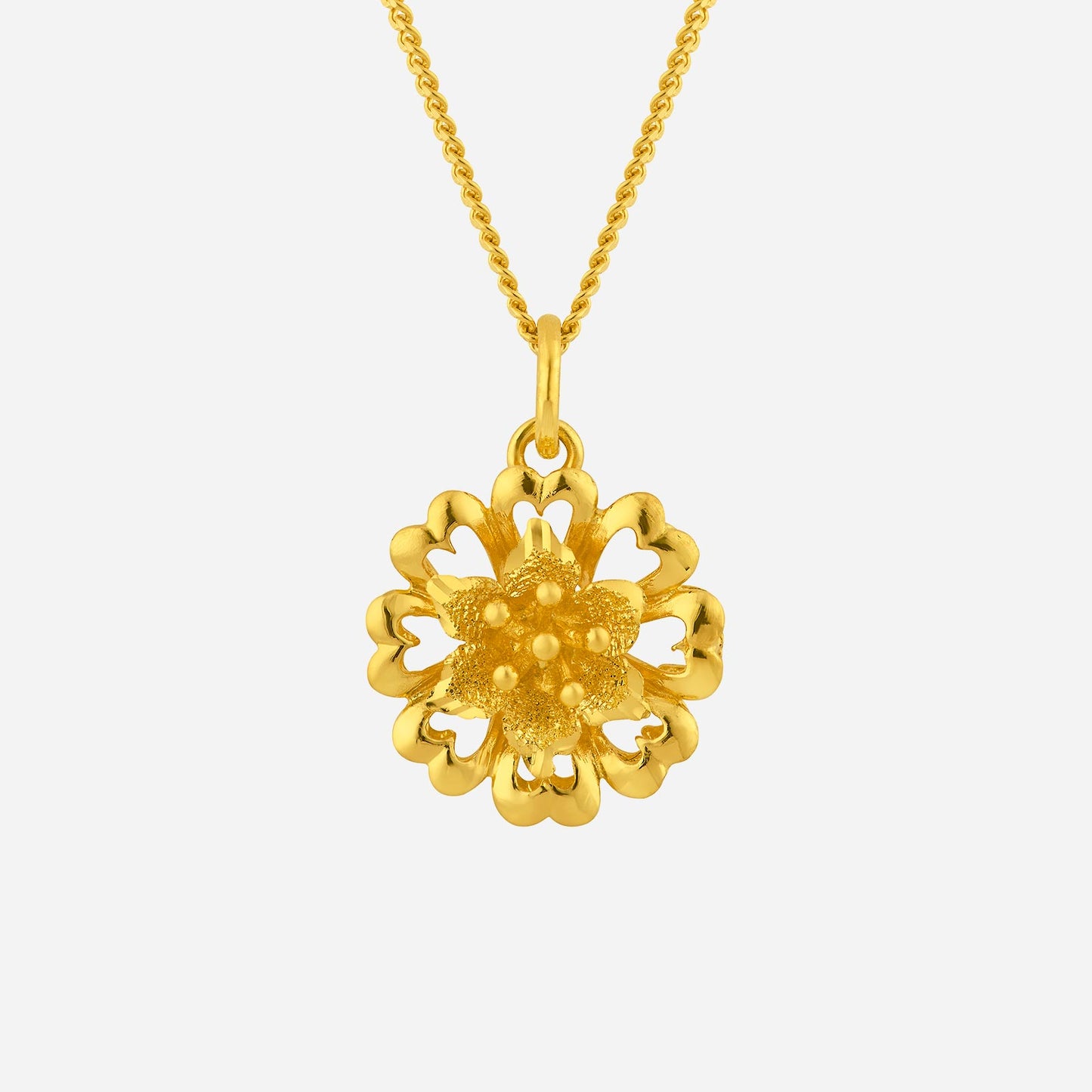 elegant flower pendant in 24k yellow gold with intricate detailing and blooming floral design. chain sold separately.