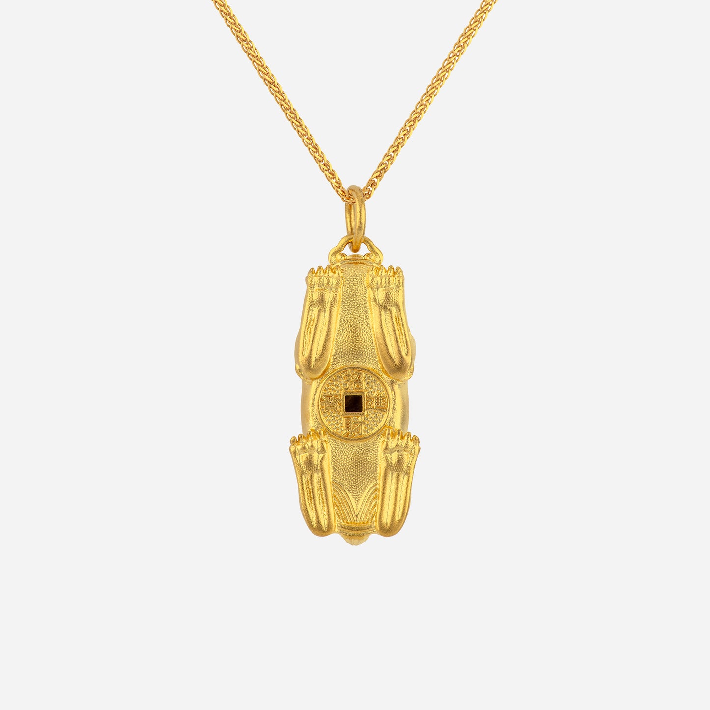 pi xiu pendant in 24k yellow gold, intricately designed with a central square gemstone, symbolizing wealth and protection.