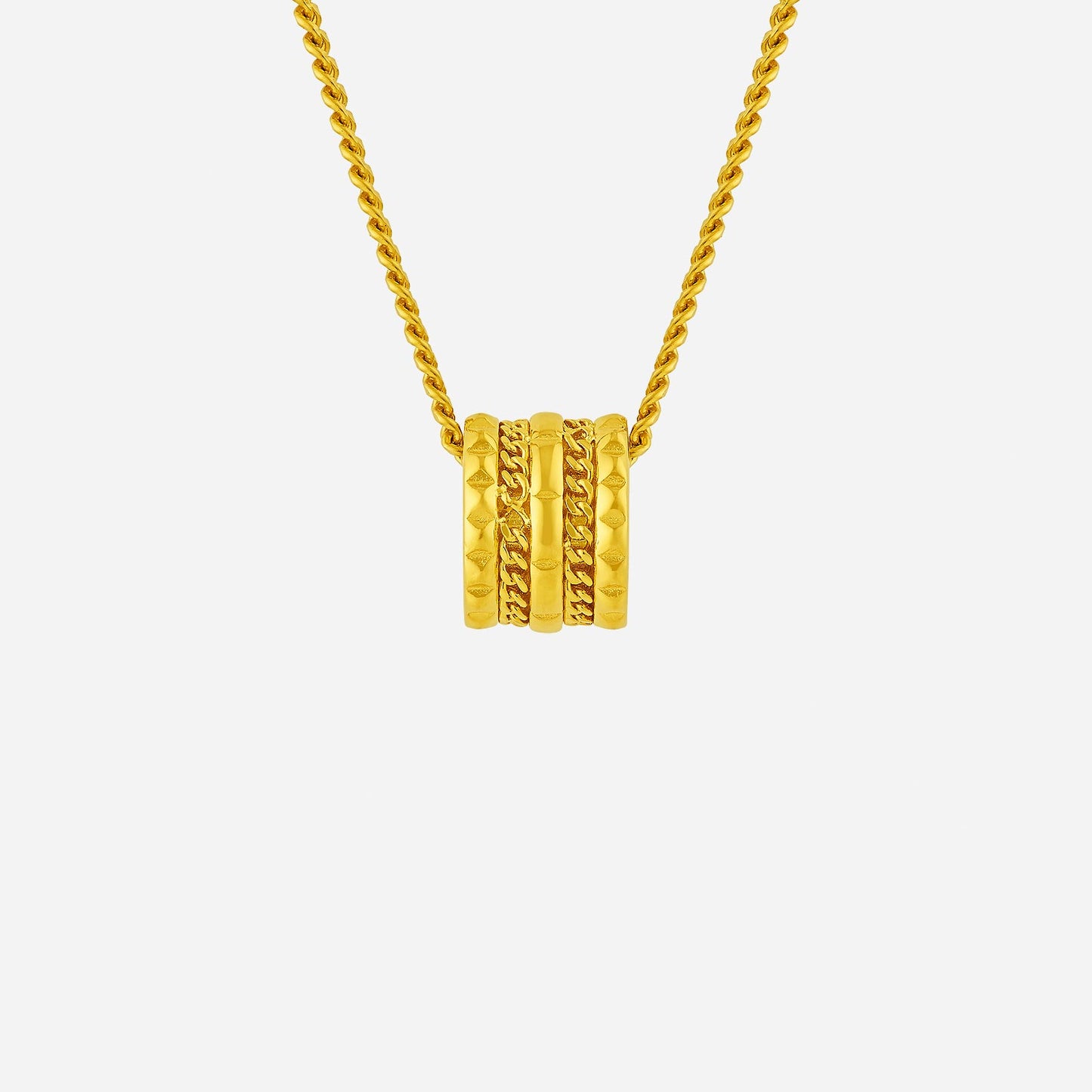 sculpted barrel pendant in 24k yellow gold with varied textures and a modern design on a twisted chain.